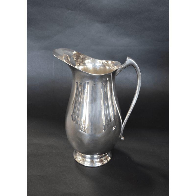 Pair of Silver Pitchers in the Style of Georg Jensen In Good Condition For Sale In Los Angeles, CA