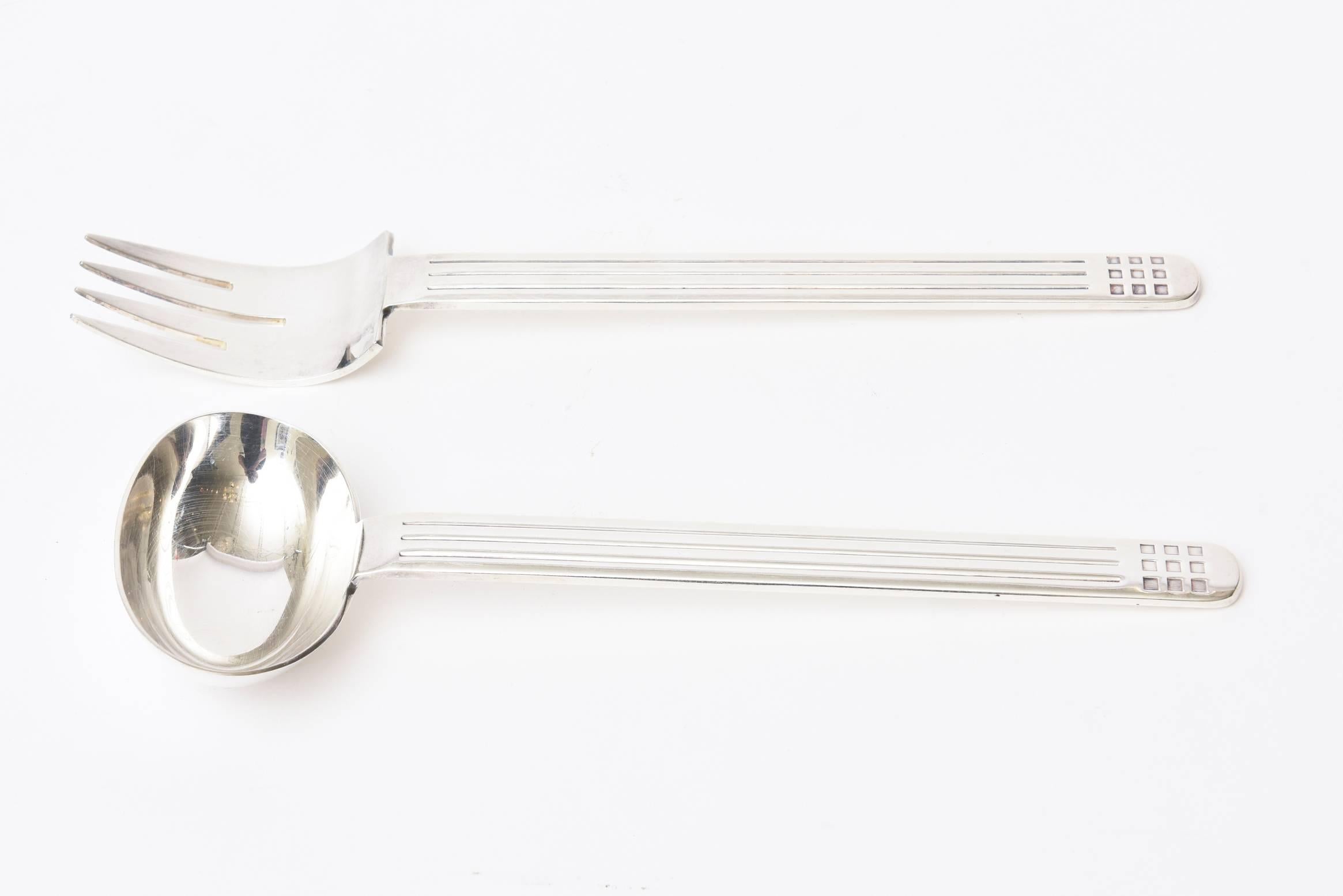 These pair of hallmarked Reed and Barton by Richard Meier for Swid Powell skyscraper sculptural silver plate serving pieces have great weight to them. They are fantastic salad servers and or serving pieces. Modern, elegant and sculptural. They are