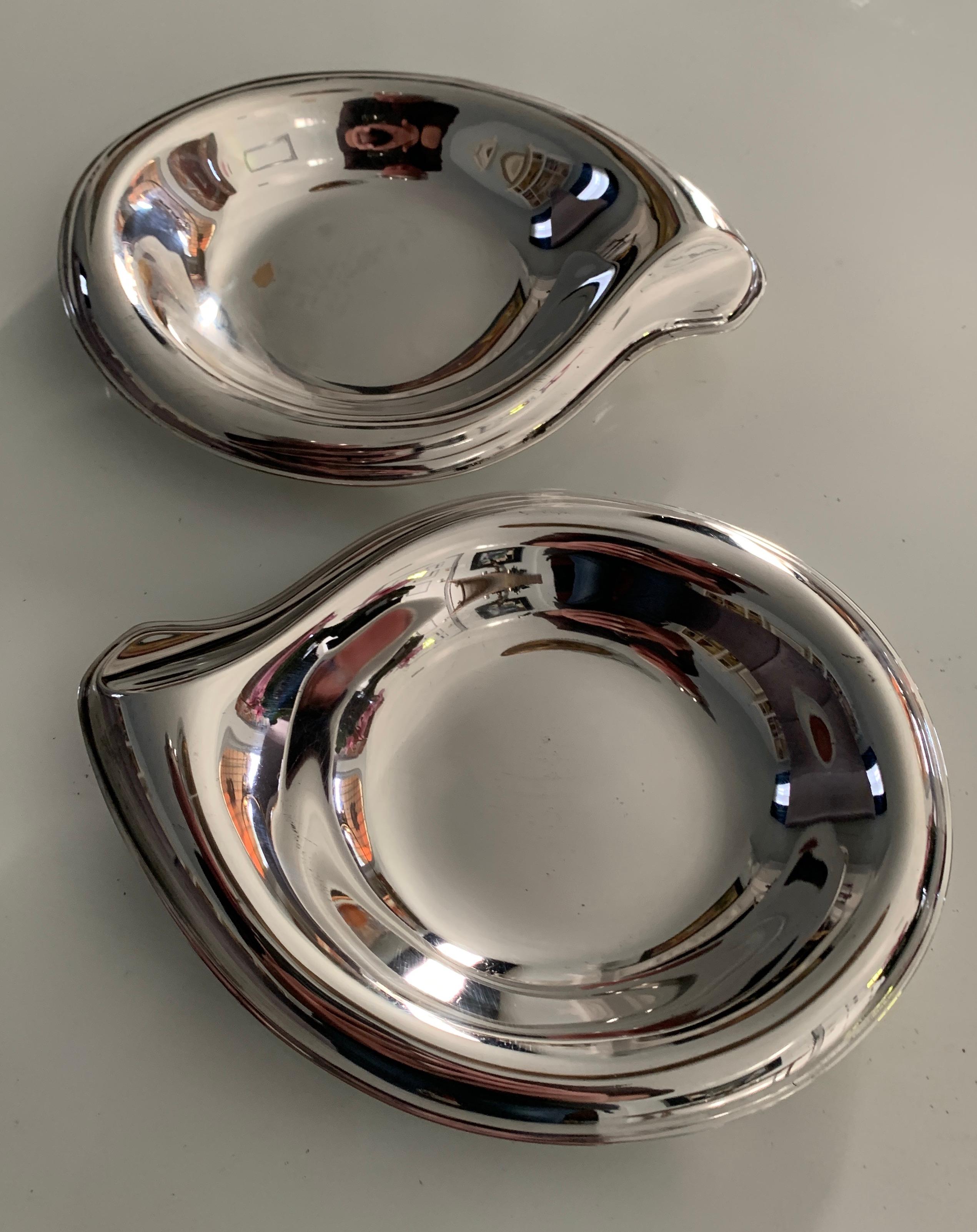 Pair of delightfully curved sliver plate dishes by Rogers, however the look is reminiscent of Elsa Peretti - organically curvaceous. Originally designed for Bon Bons, the pair well suited for the bar, for hors d'oeuvres, or for his and his soap
