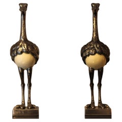 Pair of silver-plated blue-eyed ostriches with egg, 20th century