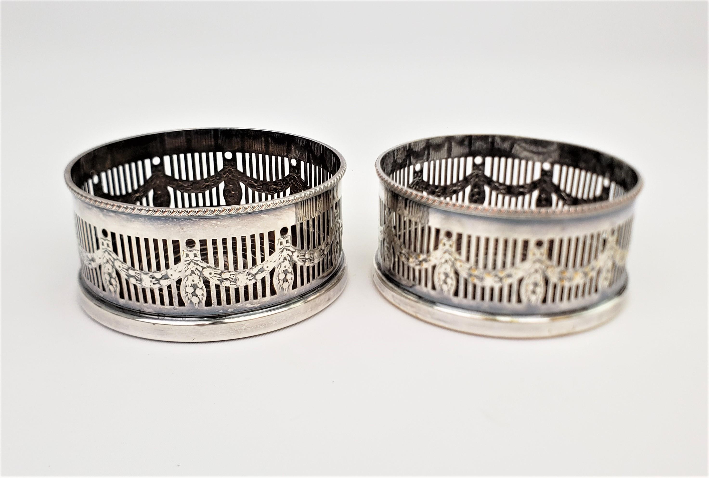 Edwardian Pair of Silver Plated Bottle Coasters with Garland Styled Gallery Sides For Sale