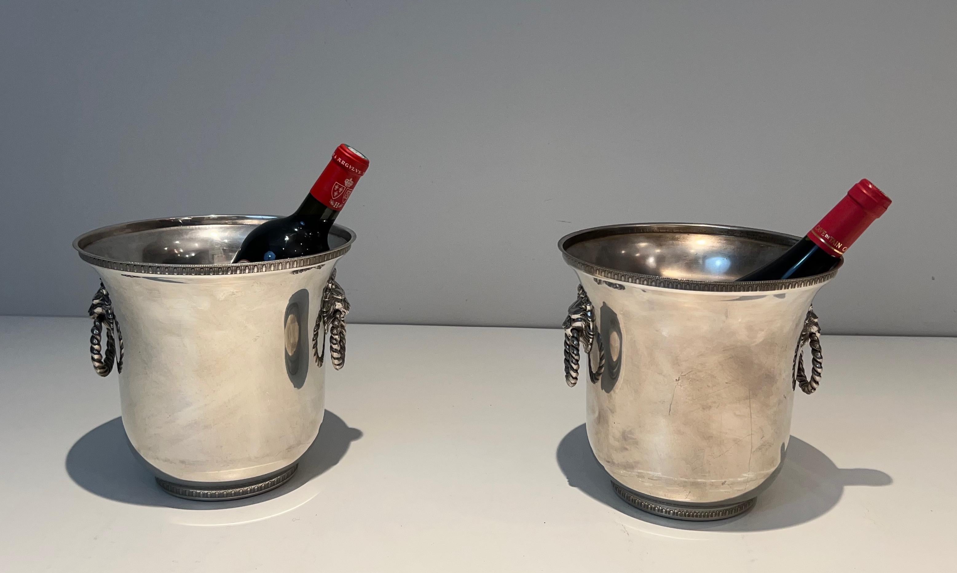 This pair of champagne buckets ornated on the handles with lion faces is made of silver-plated . This is a French work. Circa 1970