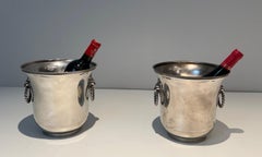 Pair of silver plated champagne buckets ornated on the handles with lion faces.