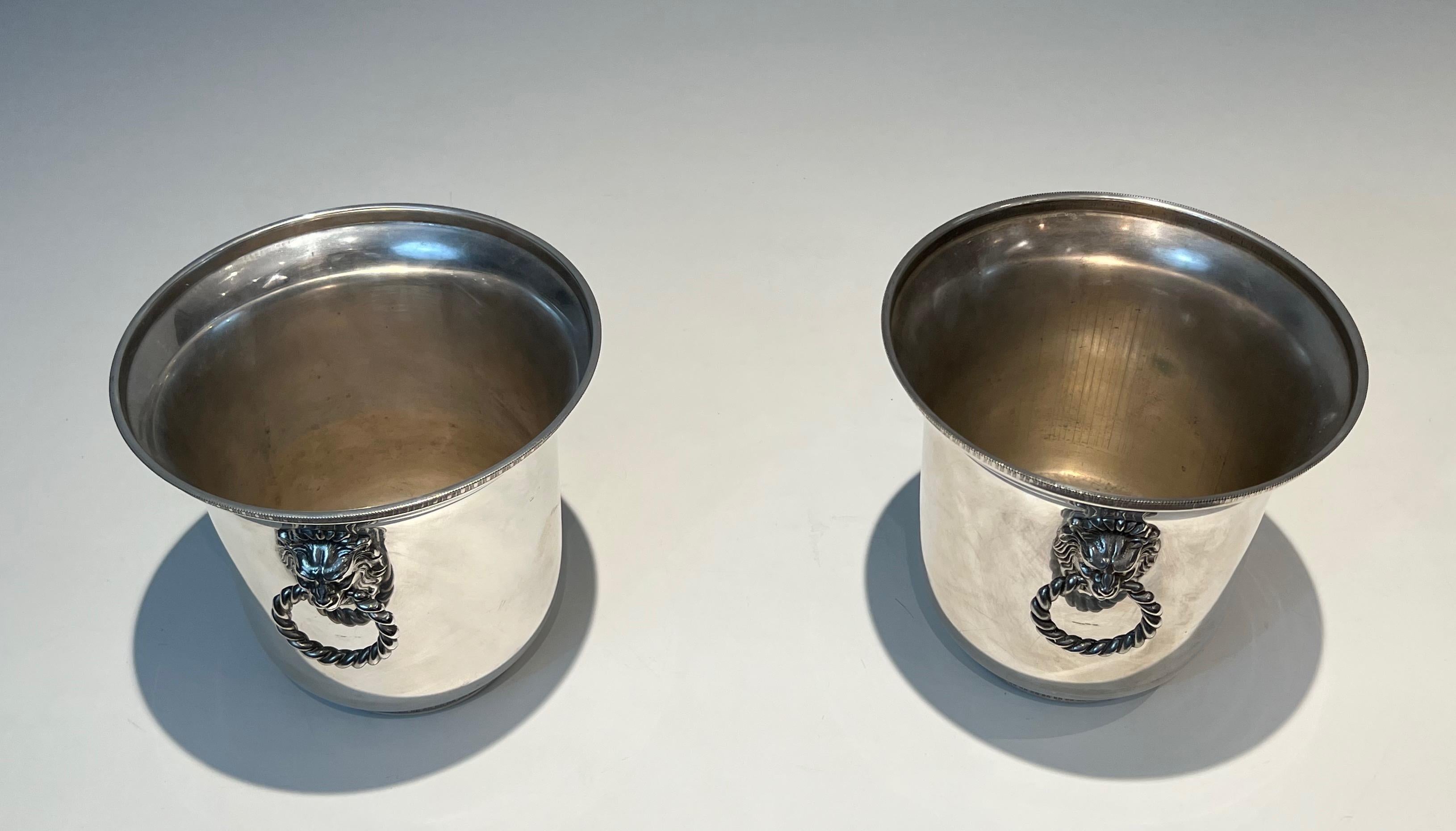 French Pair of silver plated champagne buckets ornated on the handles with lion faces.  For Sale