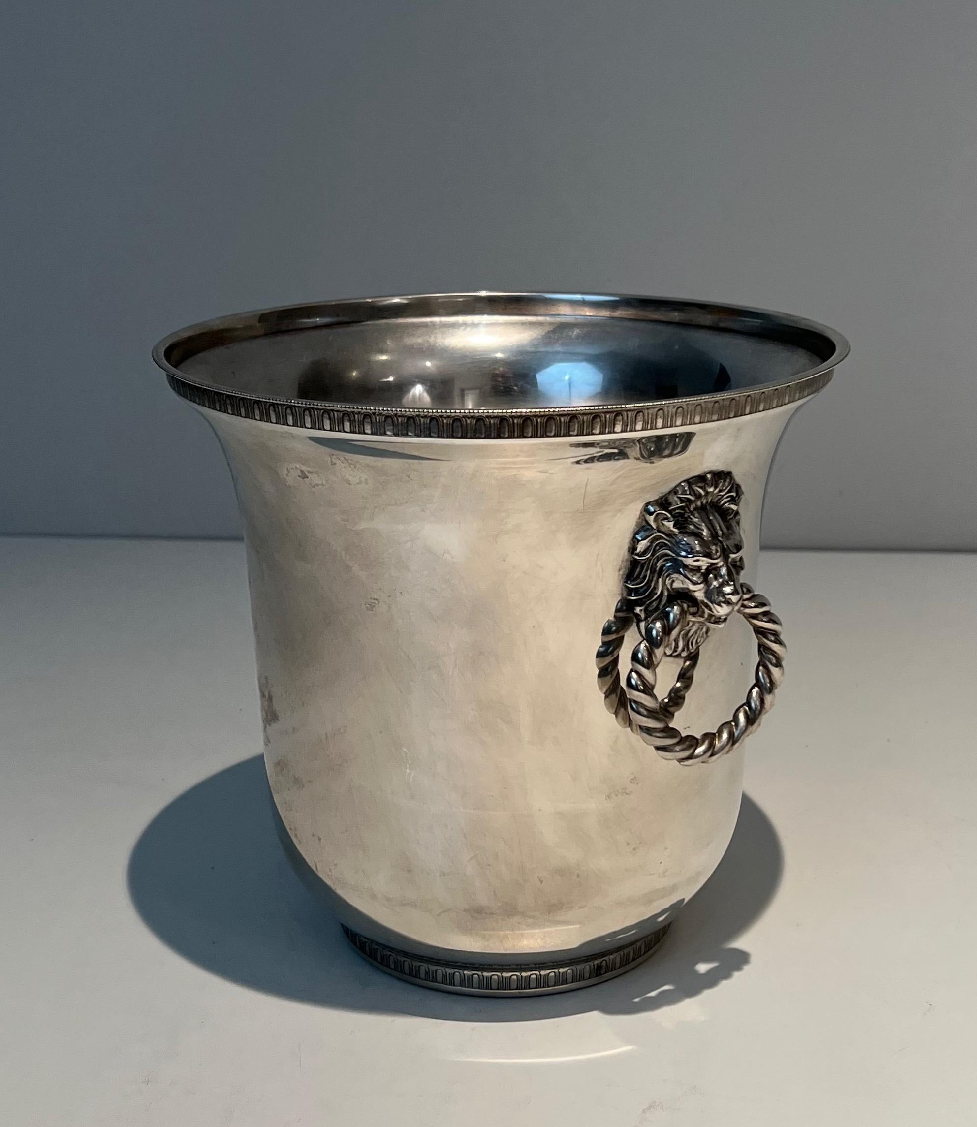 Silver Plate Pair of silver plated champagne buckets ornated on the handles with lion faces.  For Sale