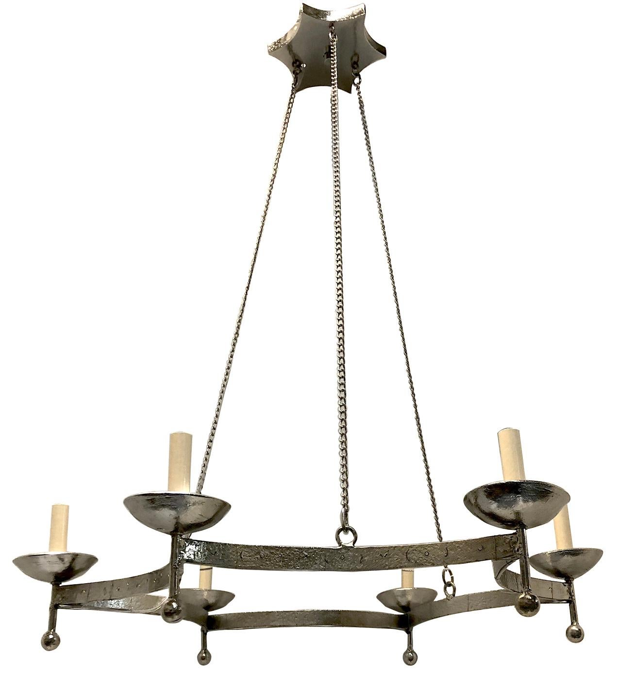 A pair of circa 1940's Italian hammered and silver plated light fixtures with 6 candelabra lights. Sold Individually

Measurements:
Current drop 42