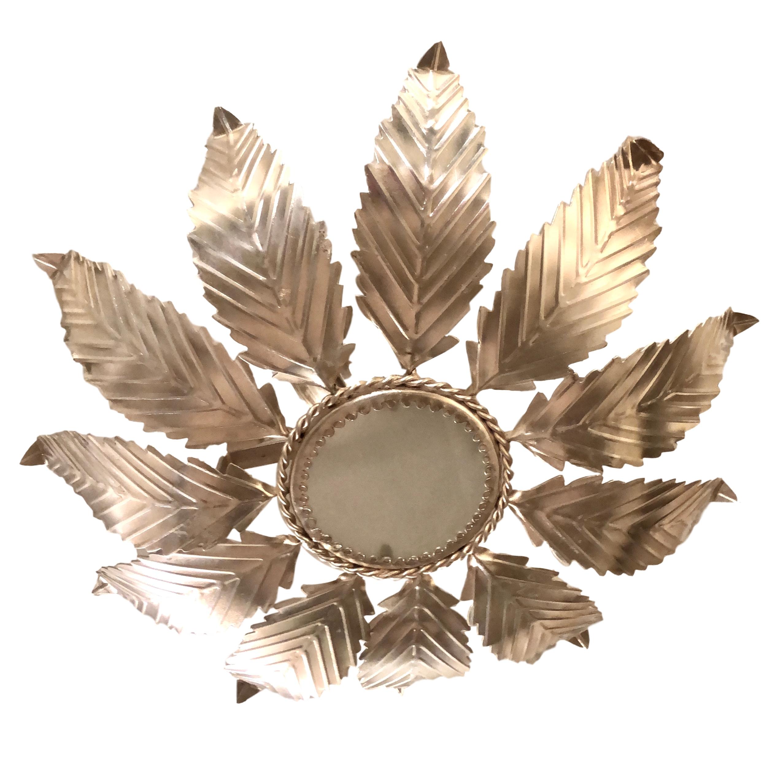 Pair of 1940's silver plated light fixtures with foliage motif. Sold individually.

Measurements: 
Drop: 7