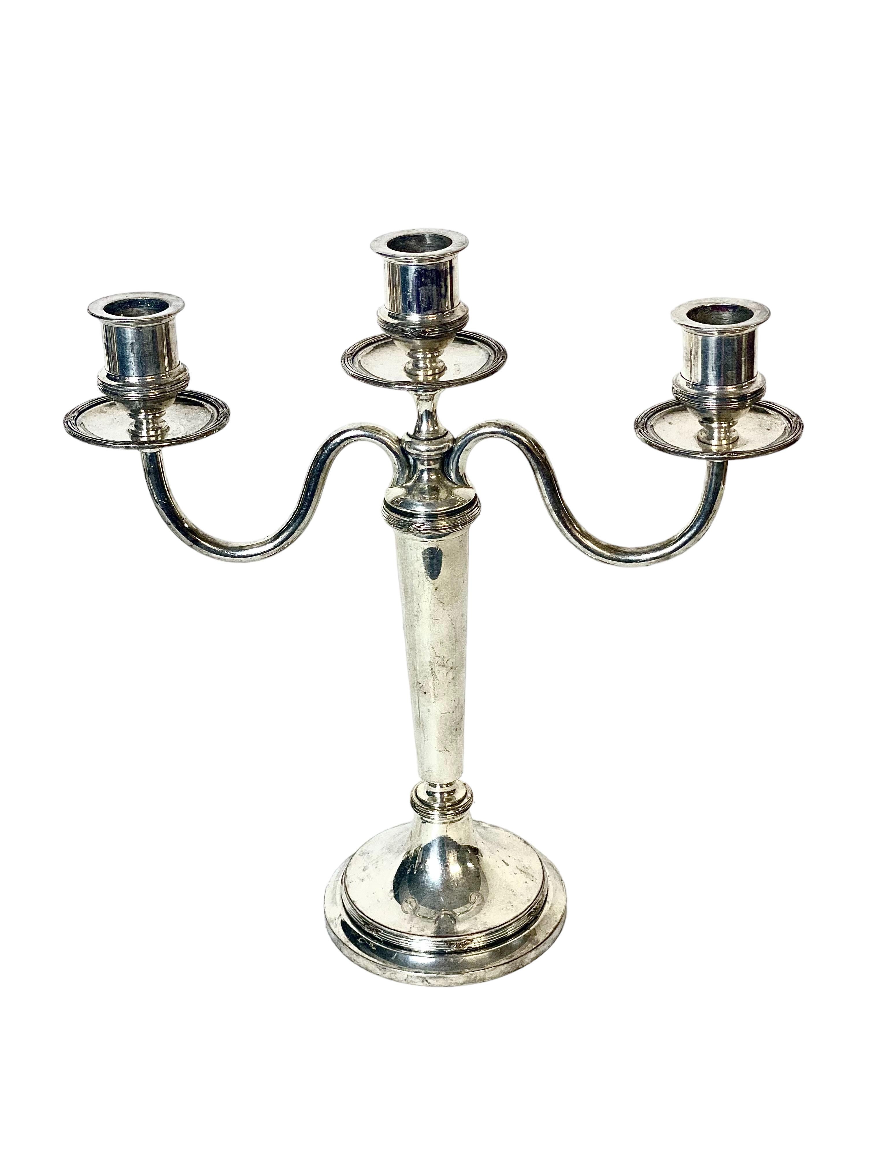 A pair of antique French three-light candelabra in silver plate, by the acclaimed silversmith Victor Saglier (1809-1894) who was known for creating beautiful pieces in ceramic, gold and silver in the Art Nouveau style of the late 19th century.