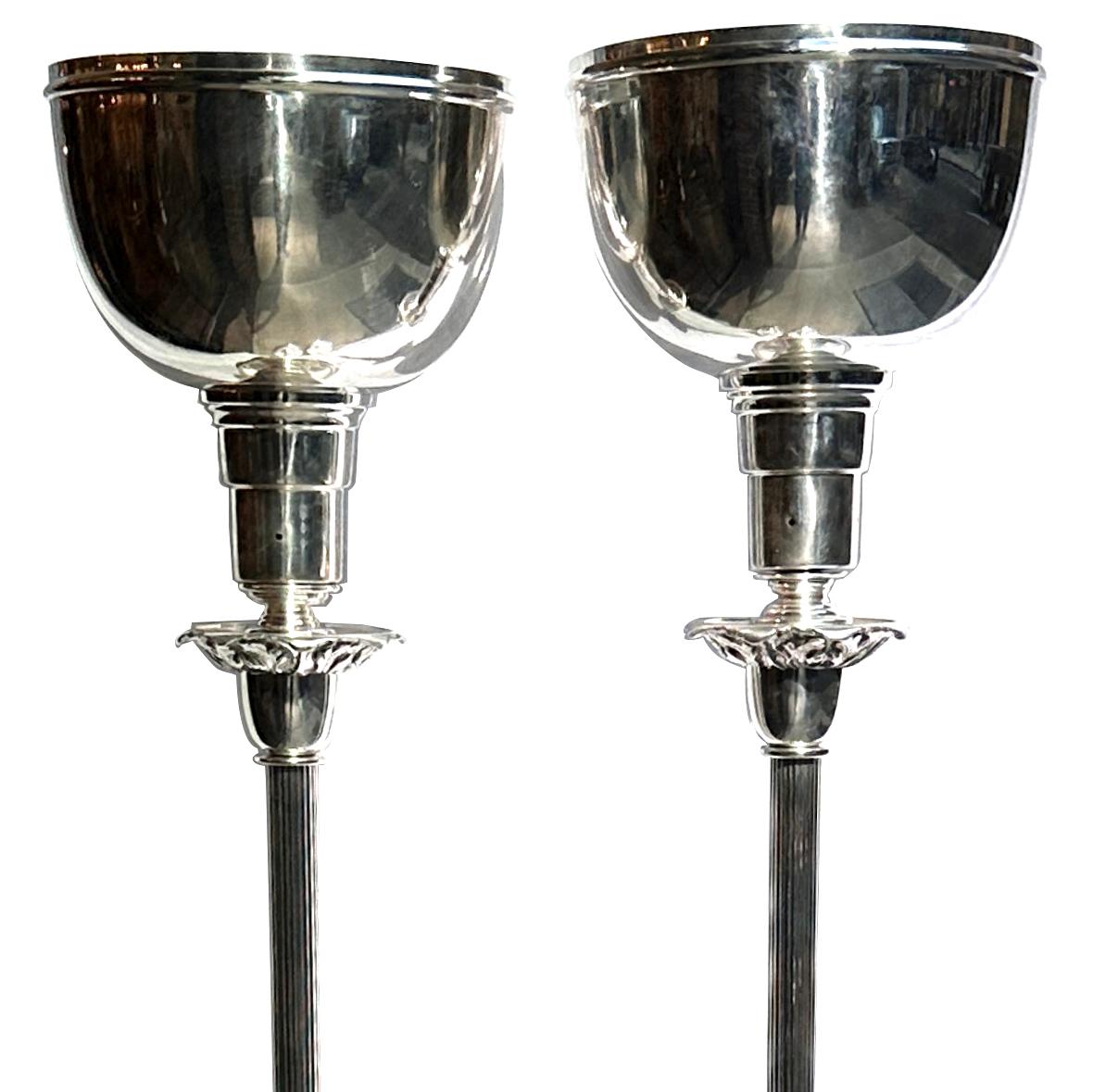 Pair of circa 1940's English silver-plated torcheres with uplight and with finely etched bases.

Measurements:
Total height: 64