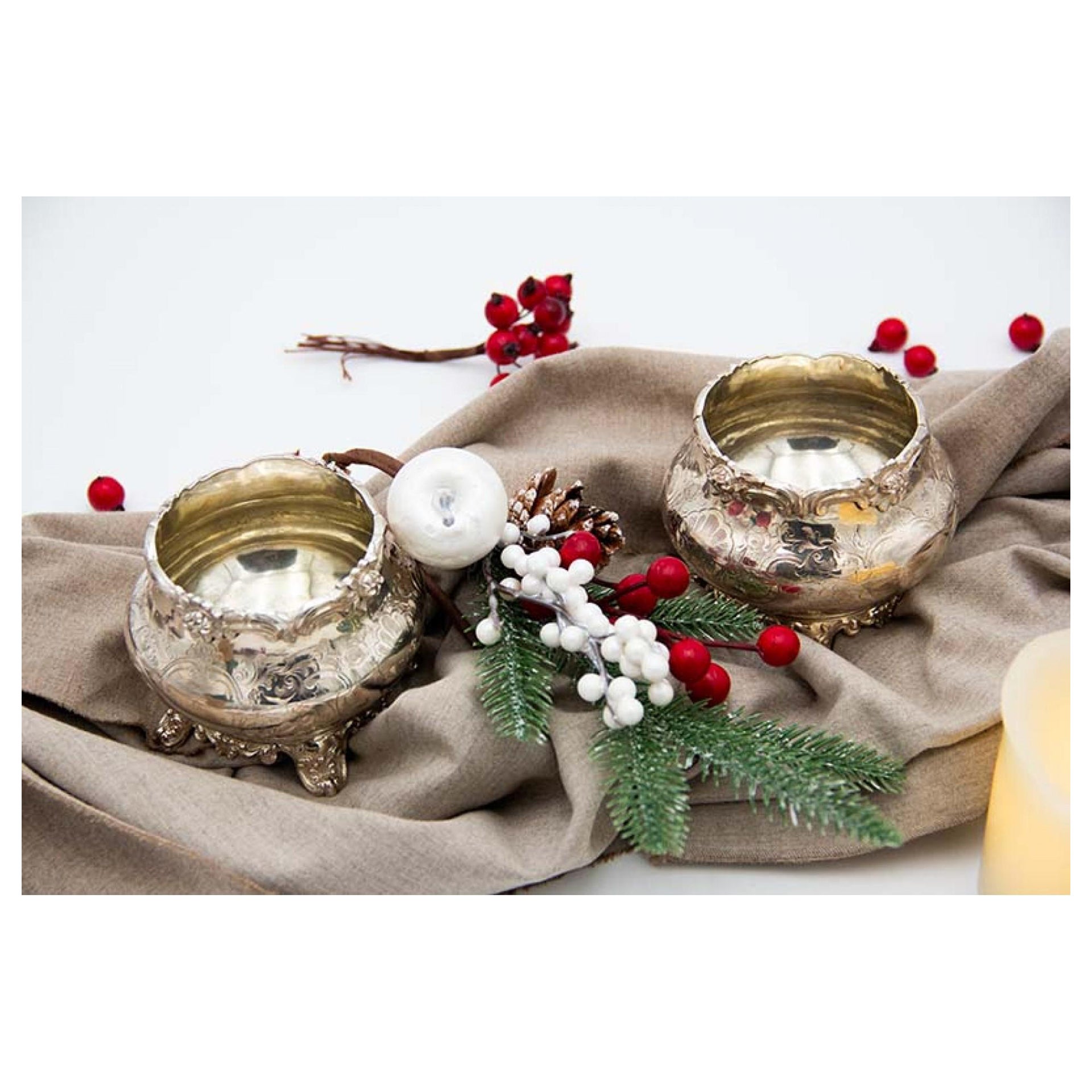 Pair of silver pots with engraved floral motifs, raised rim and four feet