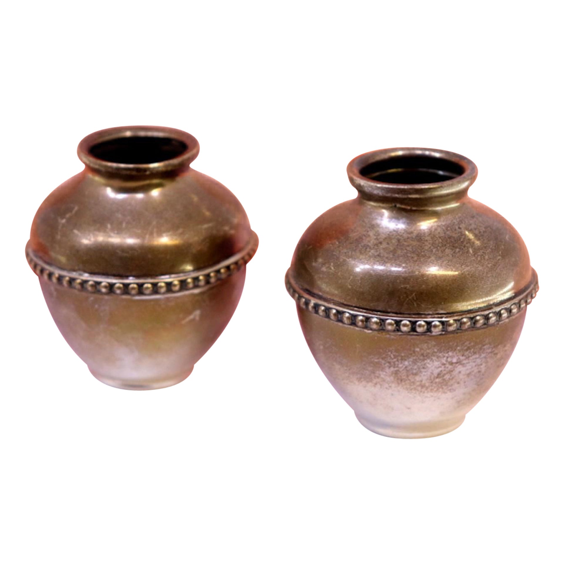 Pair of silver pots with pearly friezes around the edges