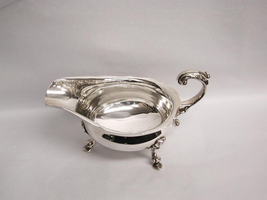 Pair of silver sauce boats dated 1933, London, Crichton & Co. Ltd
Very fine and heavy pair of silver sauce boat with lovely cast handles and feet.
This Chippendale edge style was very popular originally in the George 111 period.
One of the best
