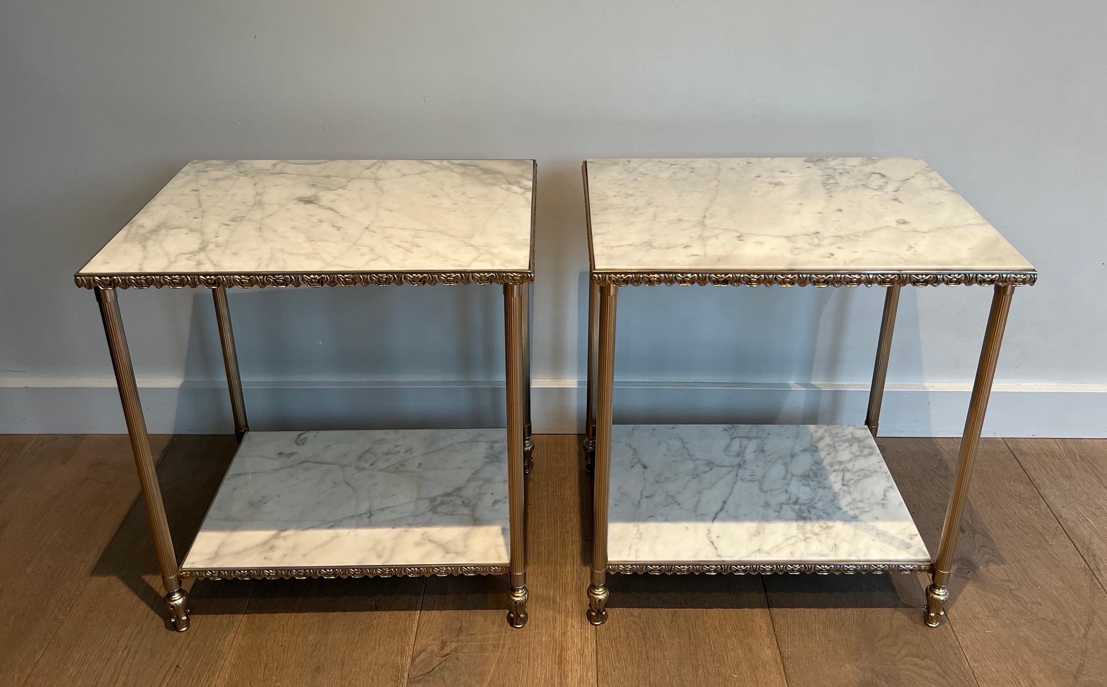 This very nice and unusual pair of side tables is made of silvered metal with Carrara marble tops. This is a French work in the style of Maison Jansen. Circa 1940