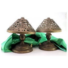 Pair of silver table lamps on circular relief bases, electrified