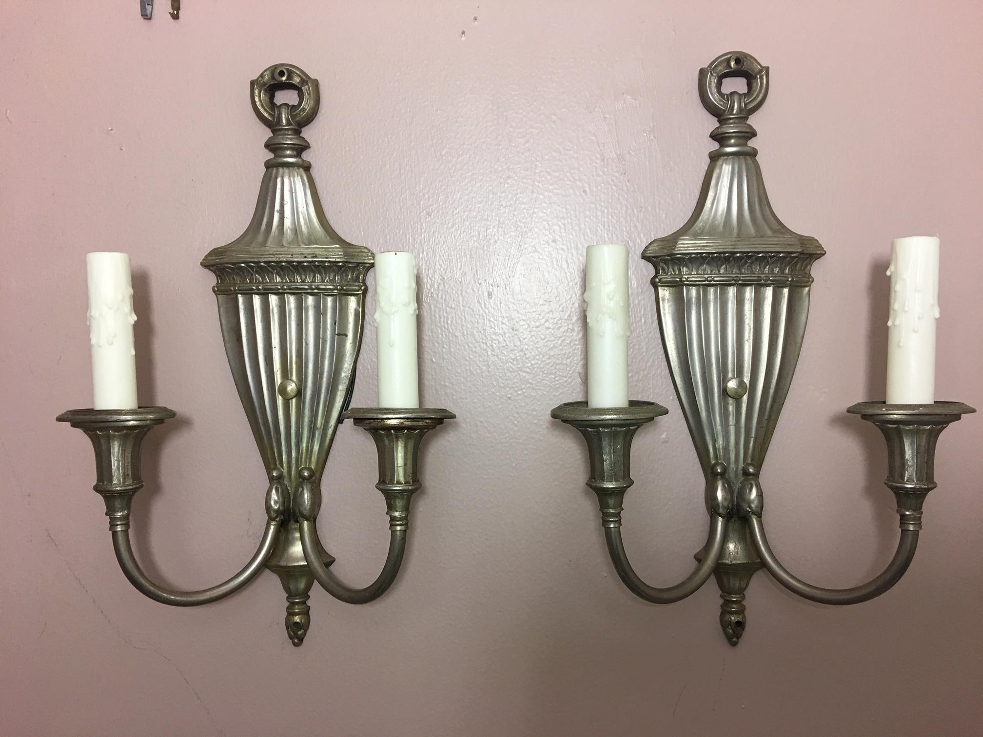 Pair of silver two-light urn sconces, mid-20th century.