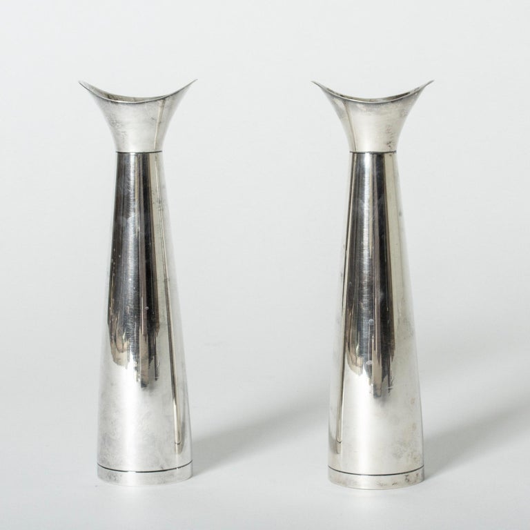 Pair of elegant silver vases by Gustaf Jansson for C. G. Hallberg. Slender form with wider mouths in an oval design. Very elegant for a single flower.

