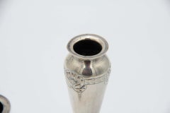 Pair of silver vases with floral reliefs