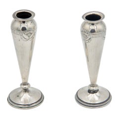 Pair of silver vases with floral reliefs