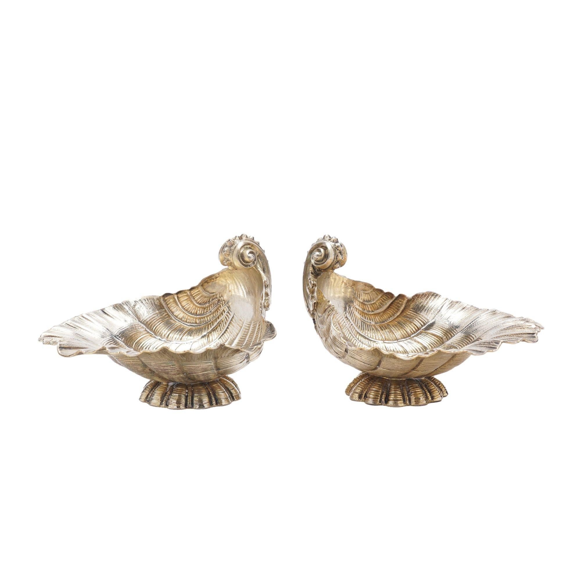 Pair of shell form open salts in silver vermeil, resting on a scalloped circular foot. Wilkens was established in Bremen, Germany in 1810 and has continued under that name to the present. The irregularity of the pre-1880 German silver hallmarks