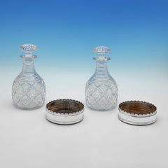 Pair of silver wine coasters & original glass decanters - Mappin & Webb 1927