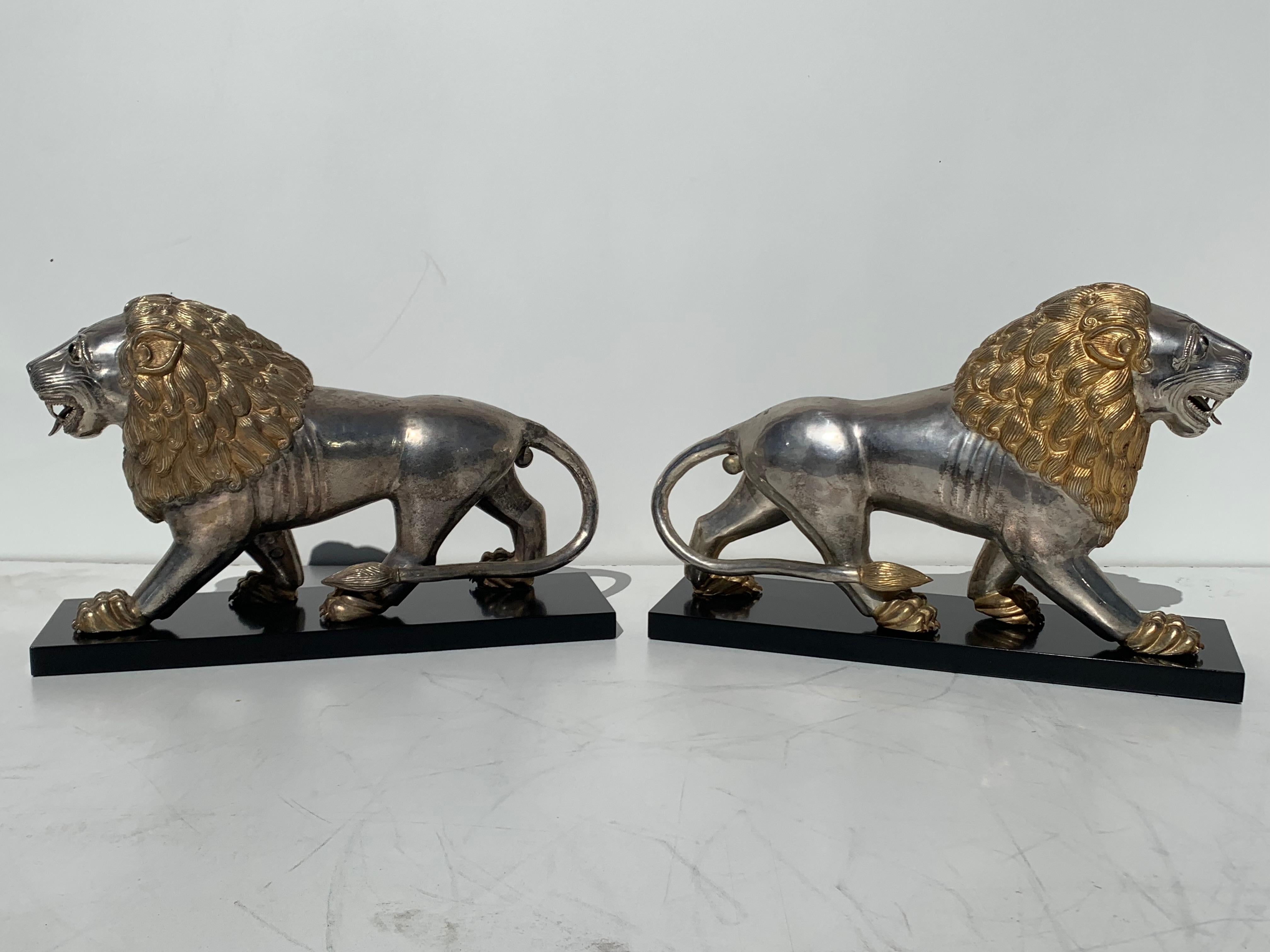 Pair of silvered brass Anglo Indian guarding lion sculptures or bookends.

 