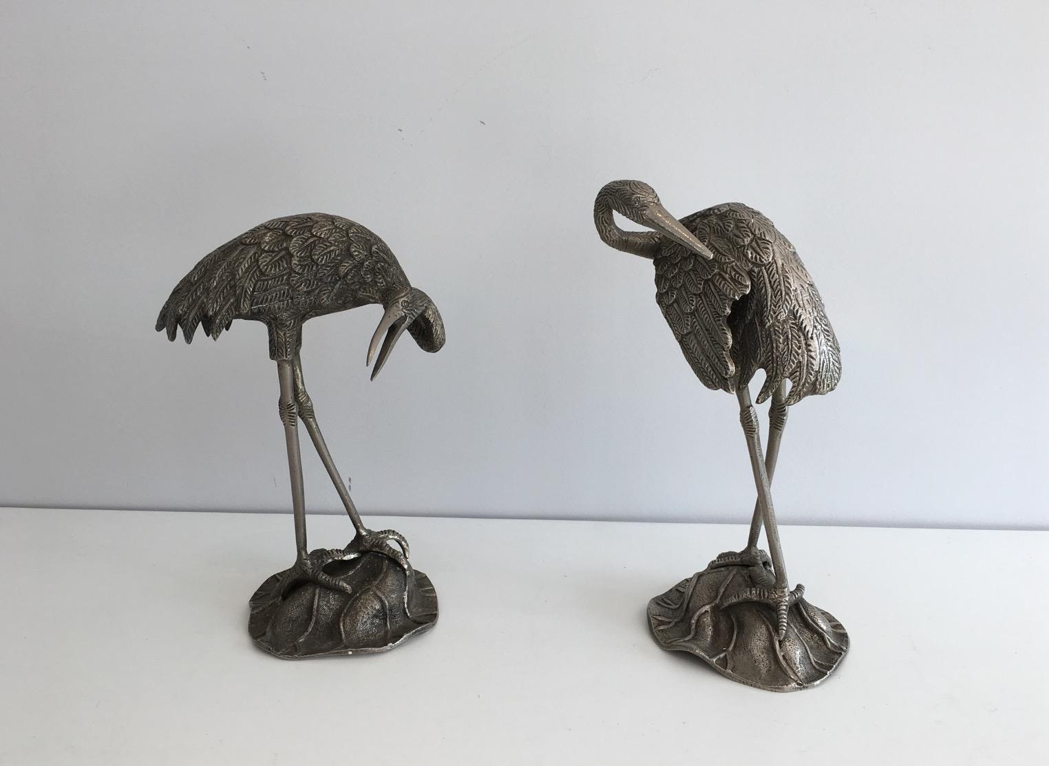 This nice and decorative pair of herons is made of silvered bronze. This is a French work, in the style of the famous Maison Bagués, circa 1940.