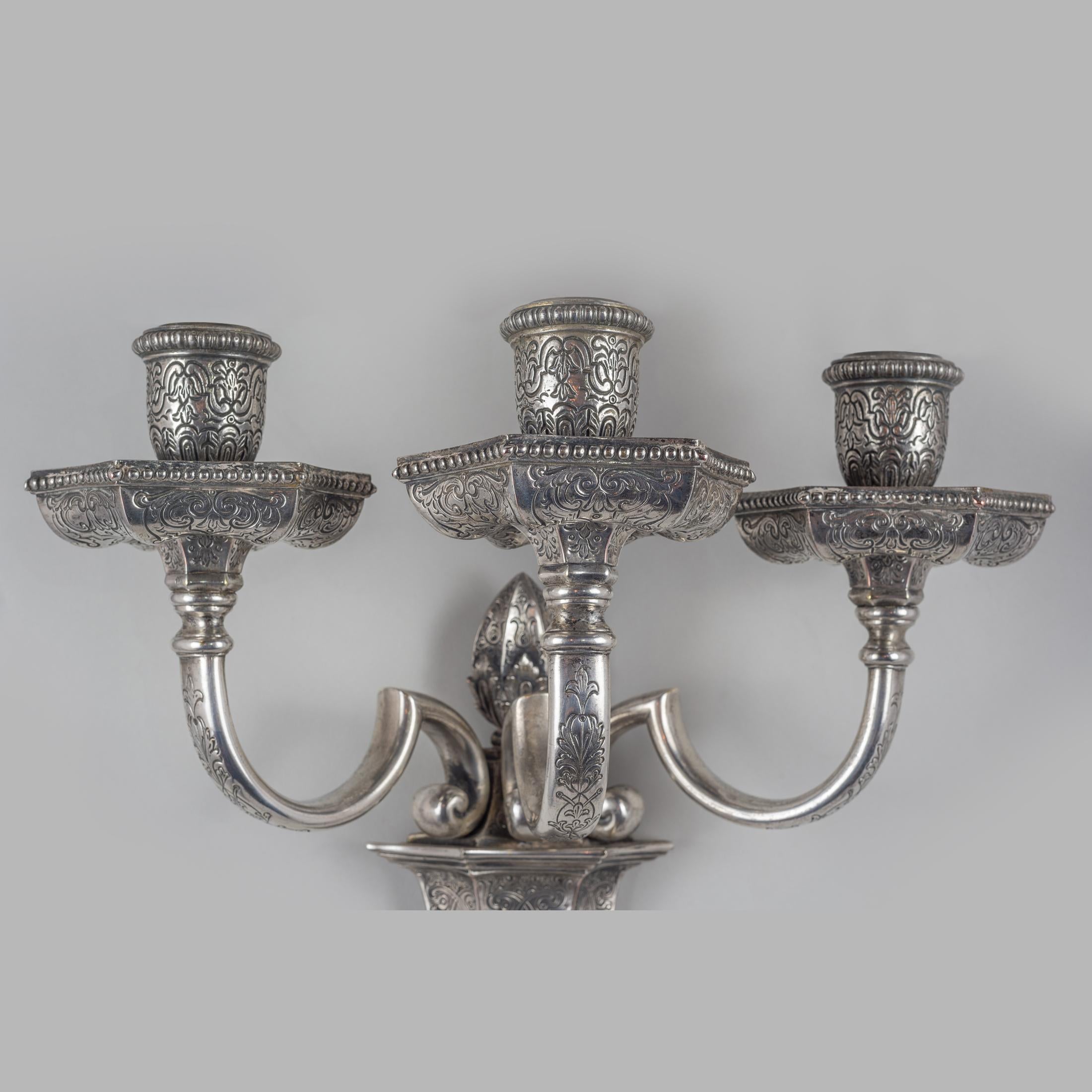 American Pair of Silvered Bronze Three-light Sconces by Edward F. Caldwell Co. For Sale