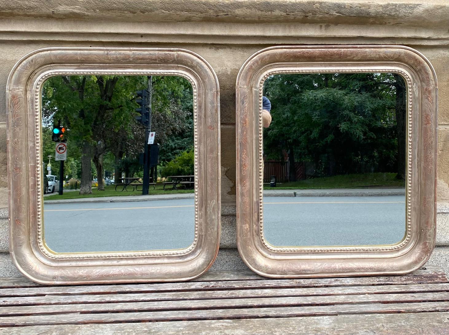 Pair of silvered leaf Louis Philippe style mirrors.