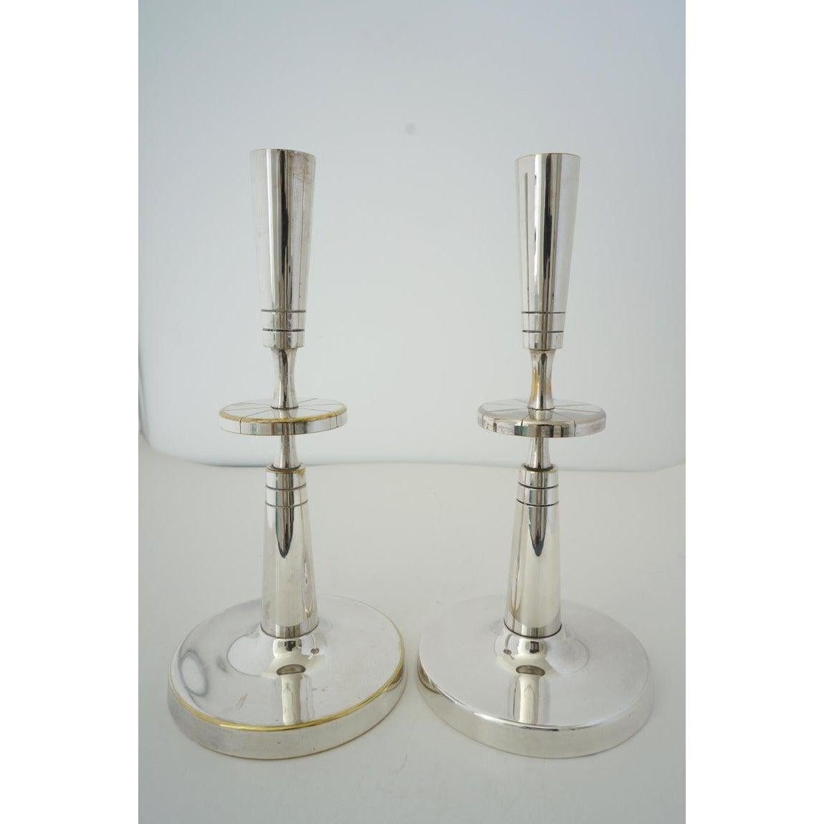 Polished Pair of Silverplate Candlesticks by Tommi Parzinger for Mueck-Cary For Sale