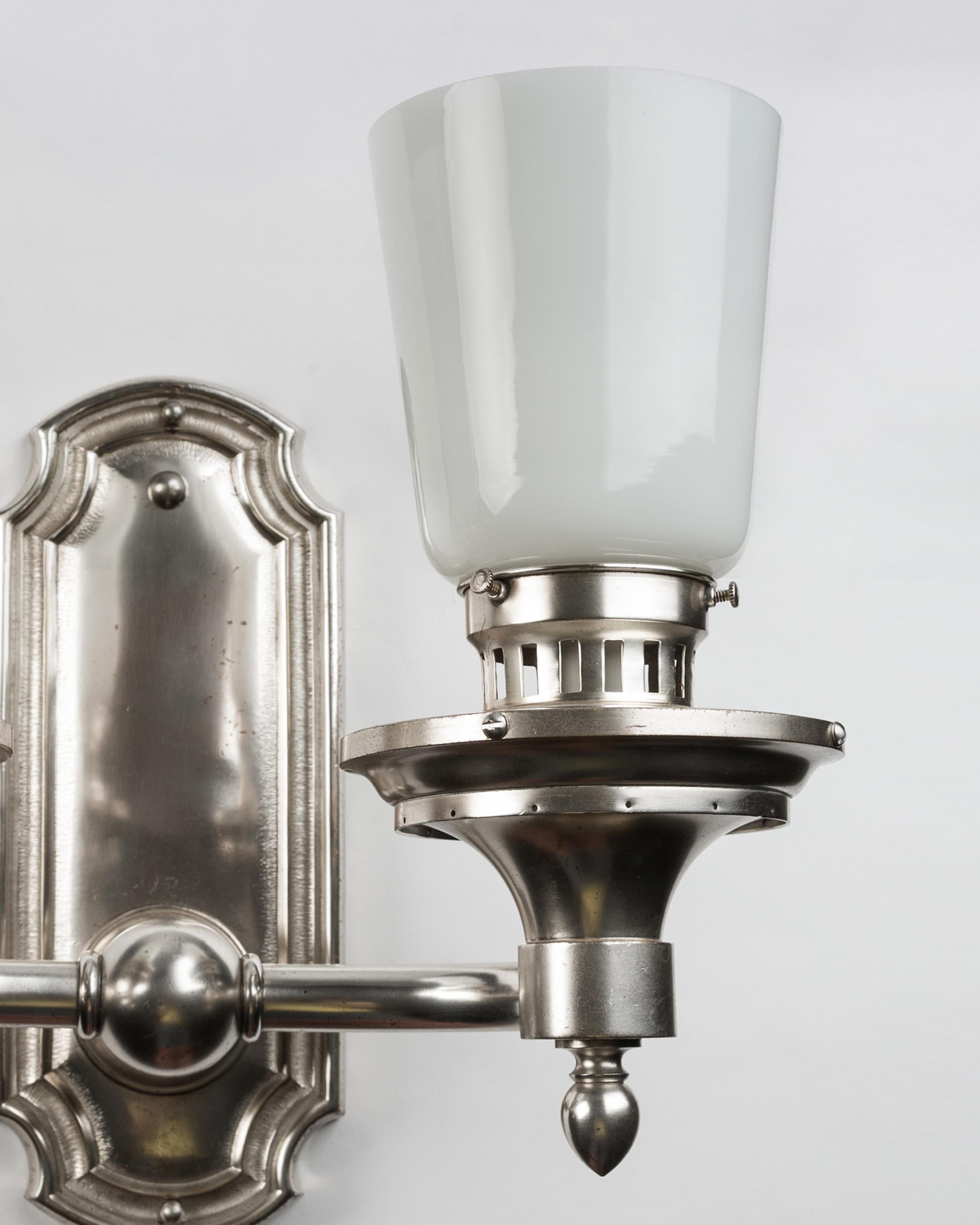 Machine Age Two Arm Silverplate Sconces with Tapered Round Opal White Glass Shades, c. 1900 For Sale