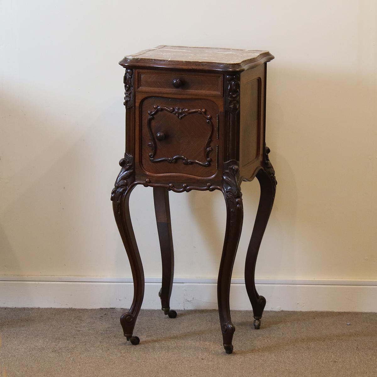 A pair of similar Louis XV style bedside tables.

These are almost a matching pair, having very similar heights, patina of wood and marble tops and will stand very nicely together.