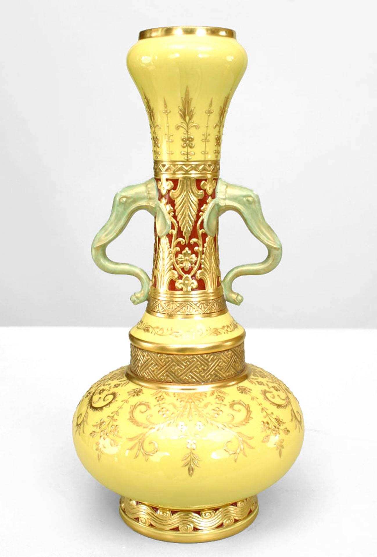 Pair OF Similar English Victorian (Minton) yellow ground bottle form vases with gilt accents and stylistic elephant head handles. (PRICED AS Pair)
