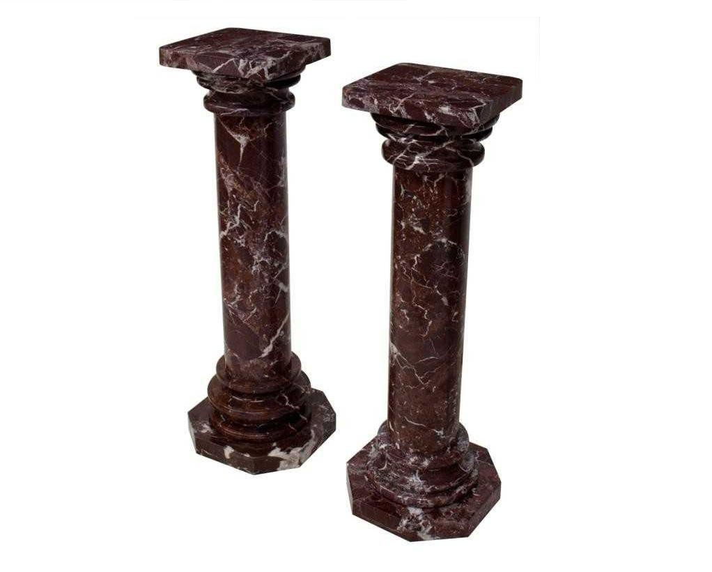 Two very similar marble column classic style pedestal  in dark red with white veining. Each pedestal can be disassembled in five parts for easier moving. All parts are solid. 
*** One pedestal is approximately 1