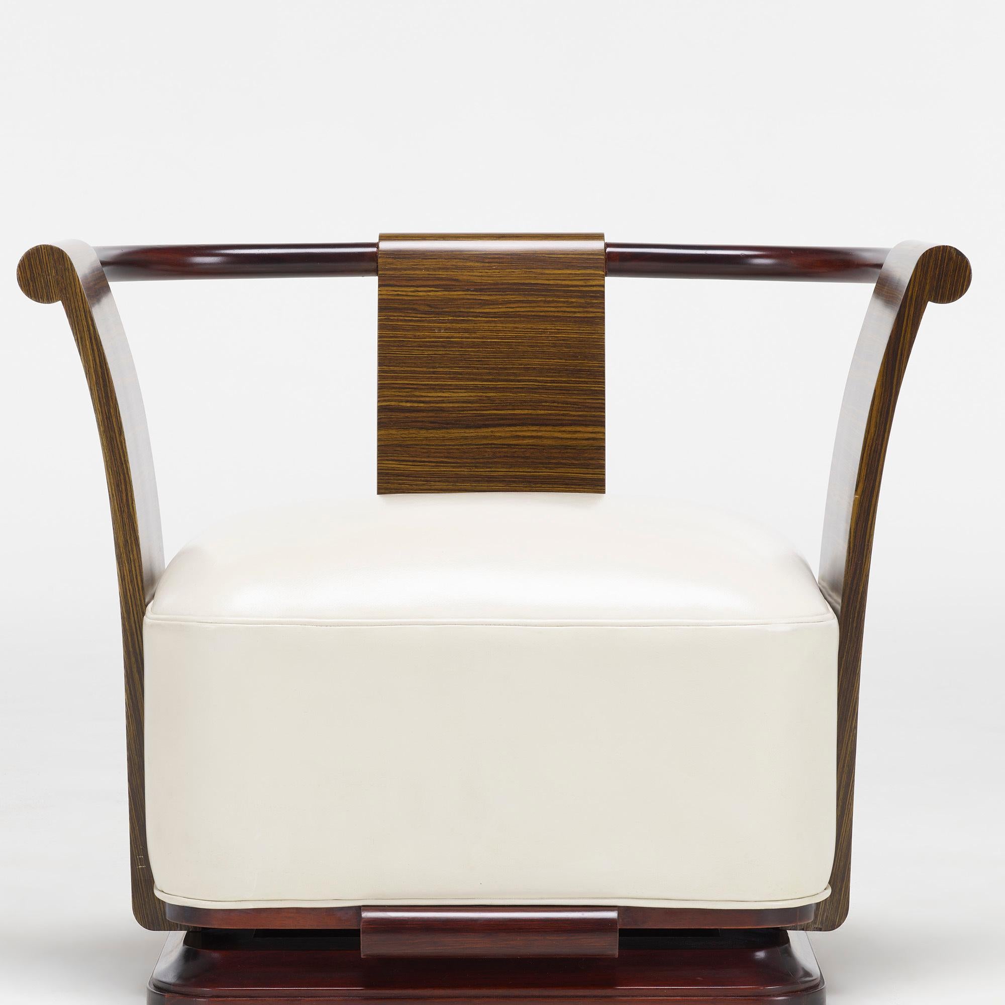 Pair of Simone chairs by William Stuart

Made by Costantini, United States, 2009

Material: Engineered macassar ebony, walnut, rosewood, leather

Size: 31.25 W × 23.5 D × 25 H Inches.

