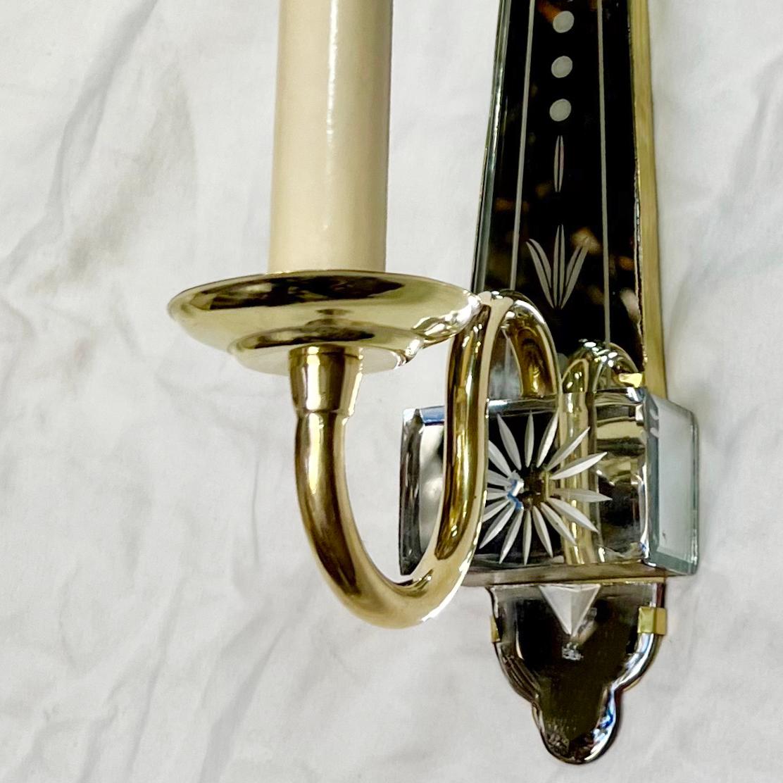 Pair of circa 1950's French single arm gilt bronze sconces with etched mirrored back.

Measurements:
Height: 11