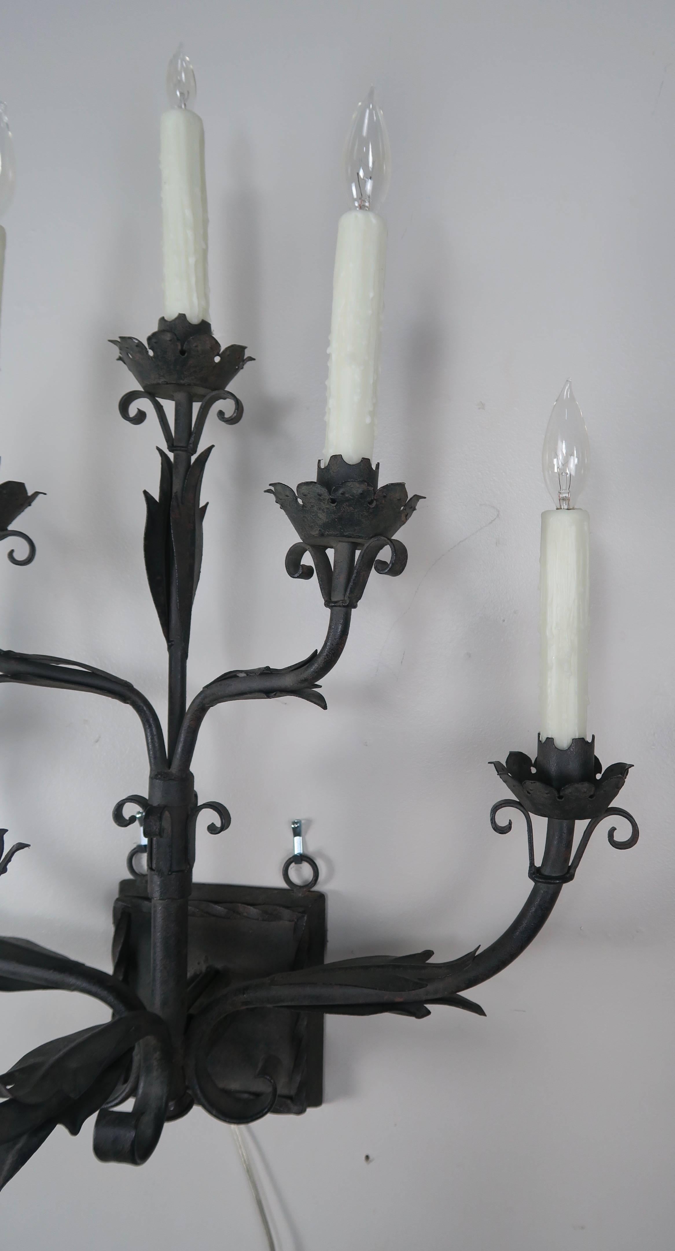 Pair of Six Light Spanish Wrought Iron Sconces In Distressed Condition In Los Angeles, CA
