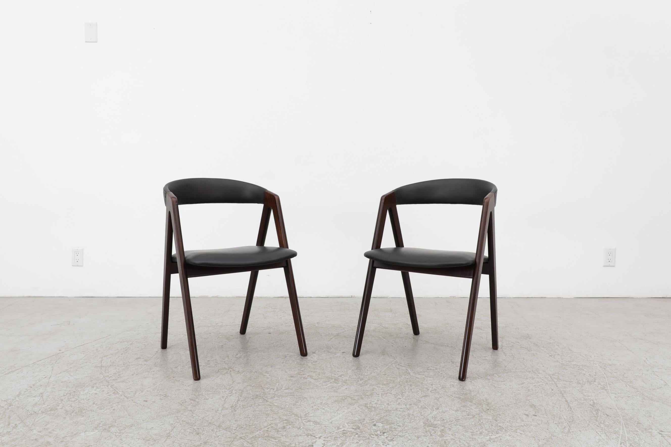 Pair of Kai Kristiansen teak chairs with black 