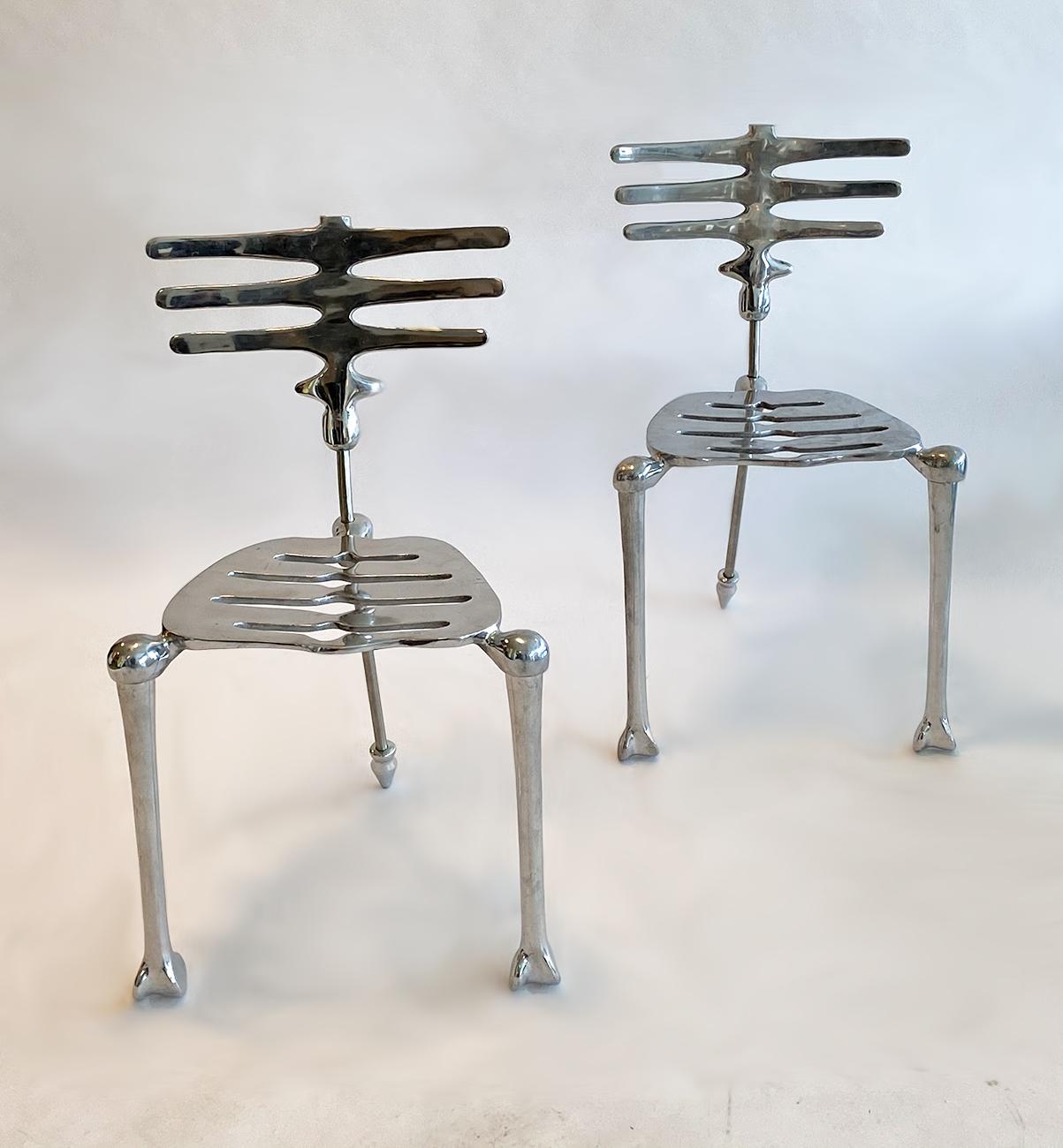 Pair of skeleton chairs by Michael Aram aluminum and stainless steel. From Aram's 'Flights of Fancy' collection.
Michael Aram Furniture is handcrafted, with no two pieces ever alike. Each piece in this collection undergoes a series of casting,