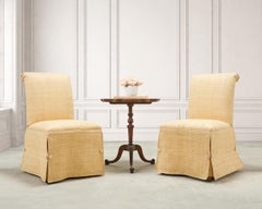 Pair of Skirted Scroll-Back Woven Raffia Slipper Chairs