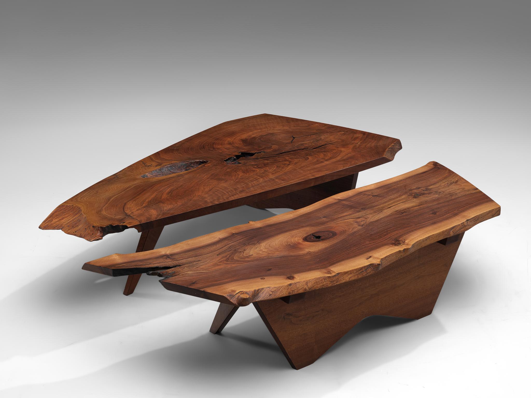 George Nakashima, two Slab coffee tables, American walnut, United States, 1960s

Two slab coffee tables made of a solid board top. The coffee tables are designed by George Nakashima to express the character of a particular slab. The first table is