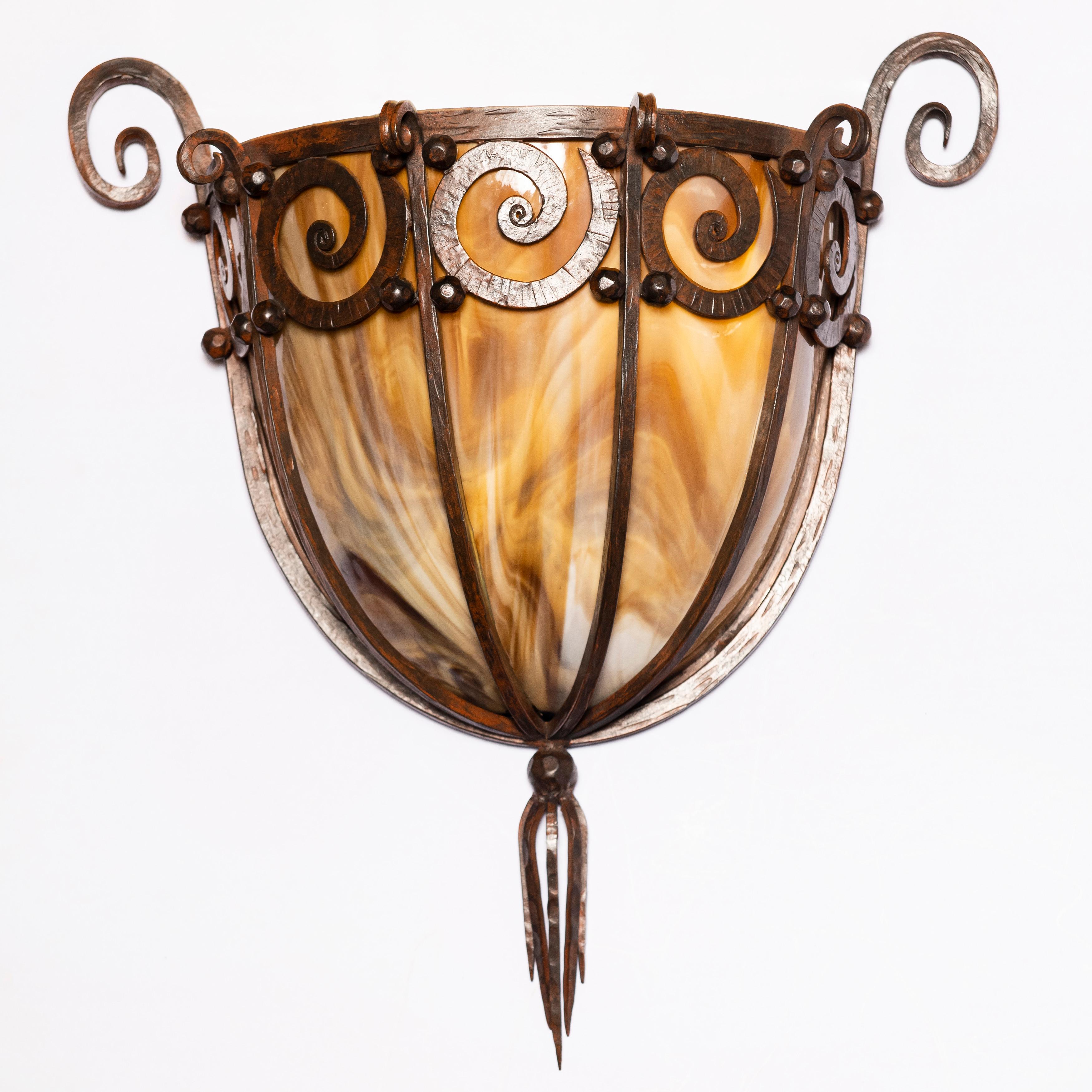 Pair of slag glass and wrought iron sconces, France, circa 1930.