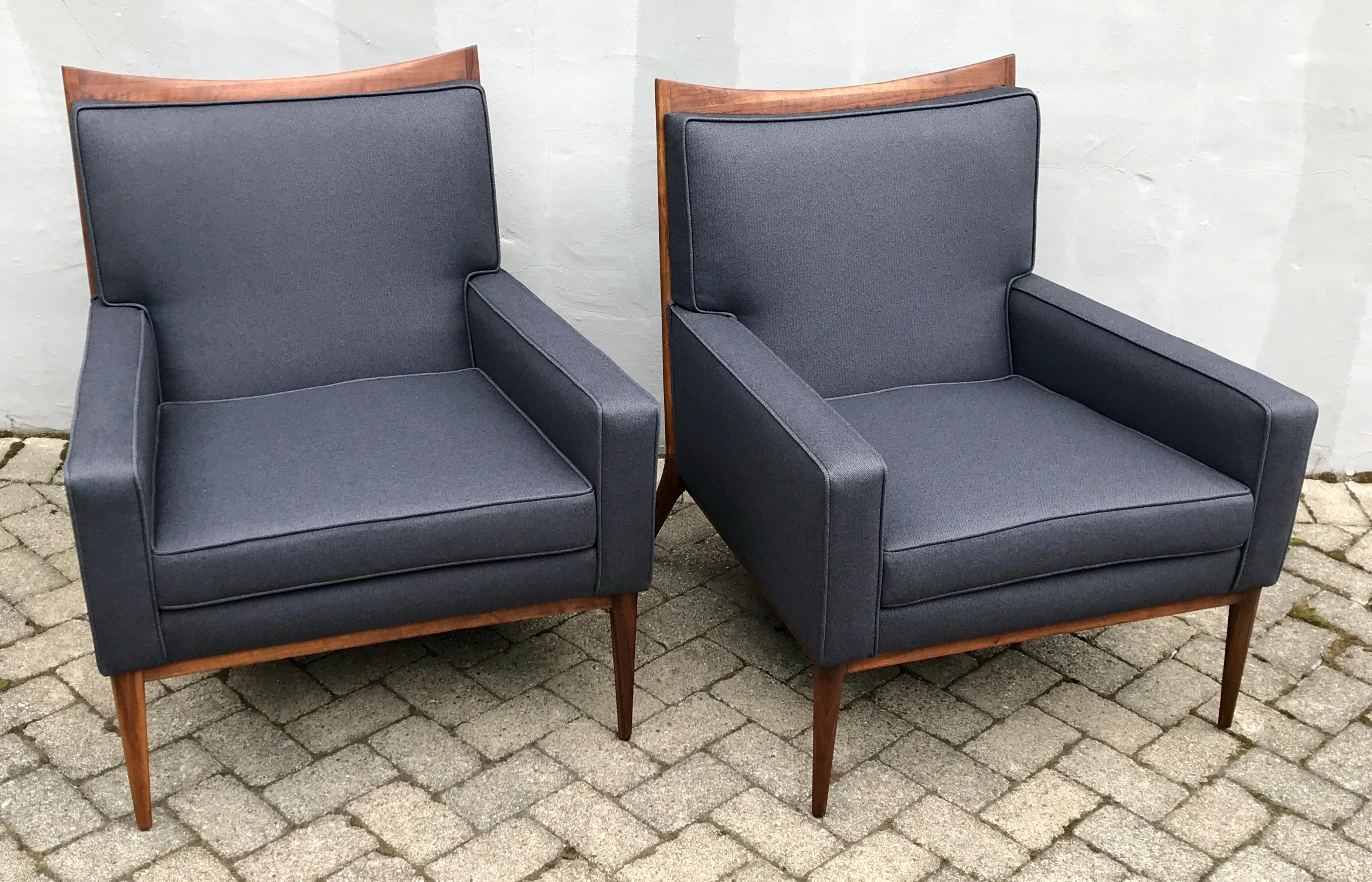 Exceptional pair of slate grey Paul McCobb club chairs for Directional, 1950s. Reupholstered in a rich slate grey fabric by Knoll Textiles, beautiful restored walnut frames, original labels.

 