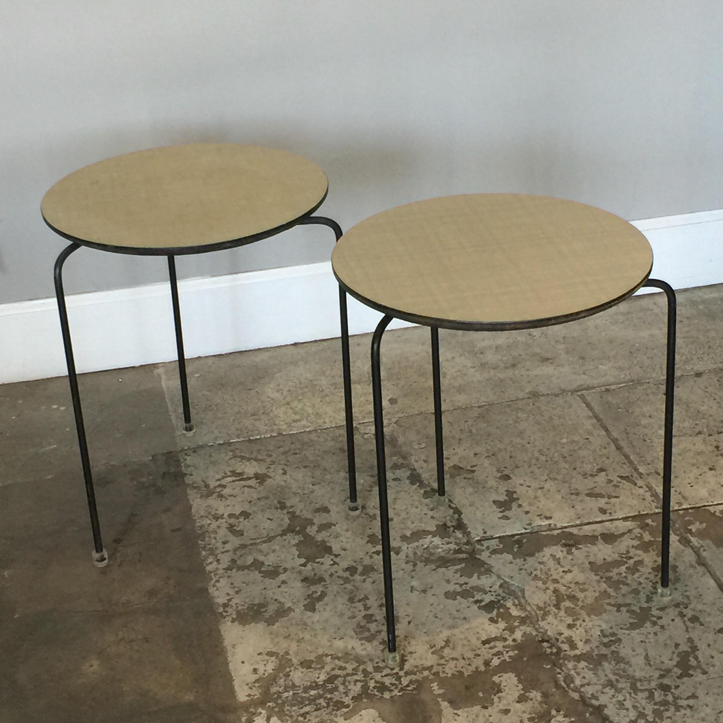 Pair of slender tripod laminate side tables with Lucite details. The top is 14.5 in. diameter.