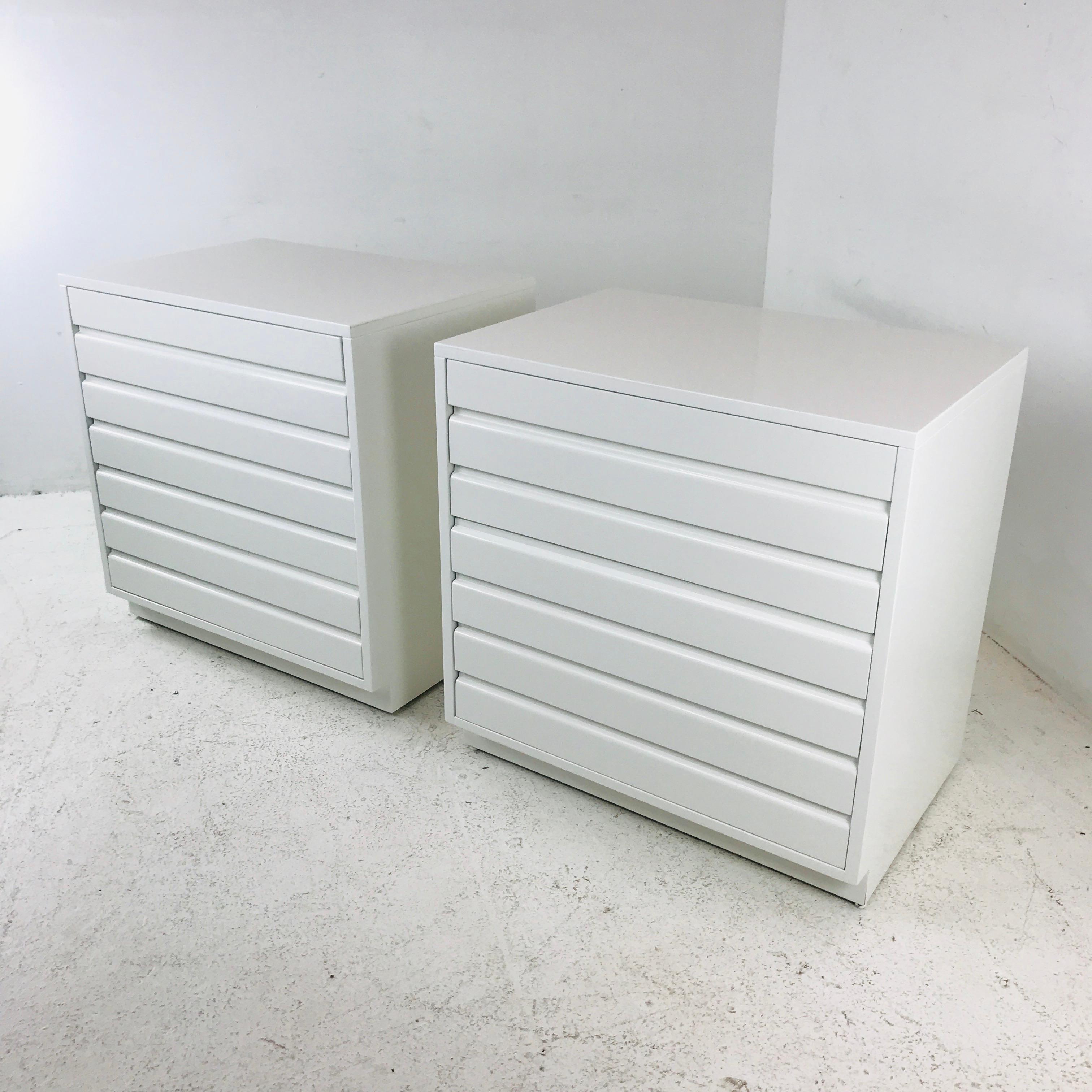 This pair of Sligh chests is newly refinished and lacquered in white. Chests have four drawers each and are perfect for nightstands.