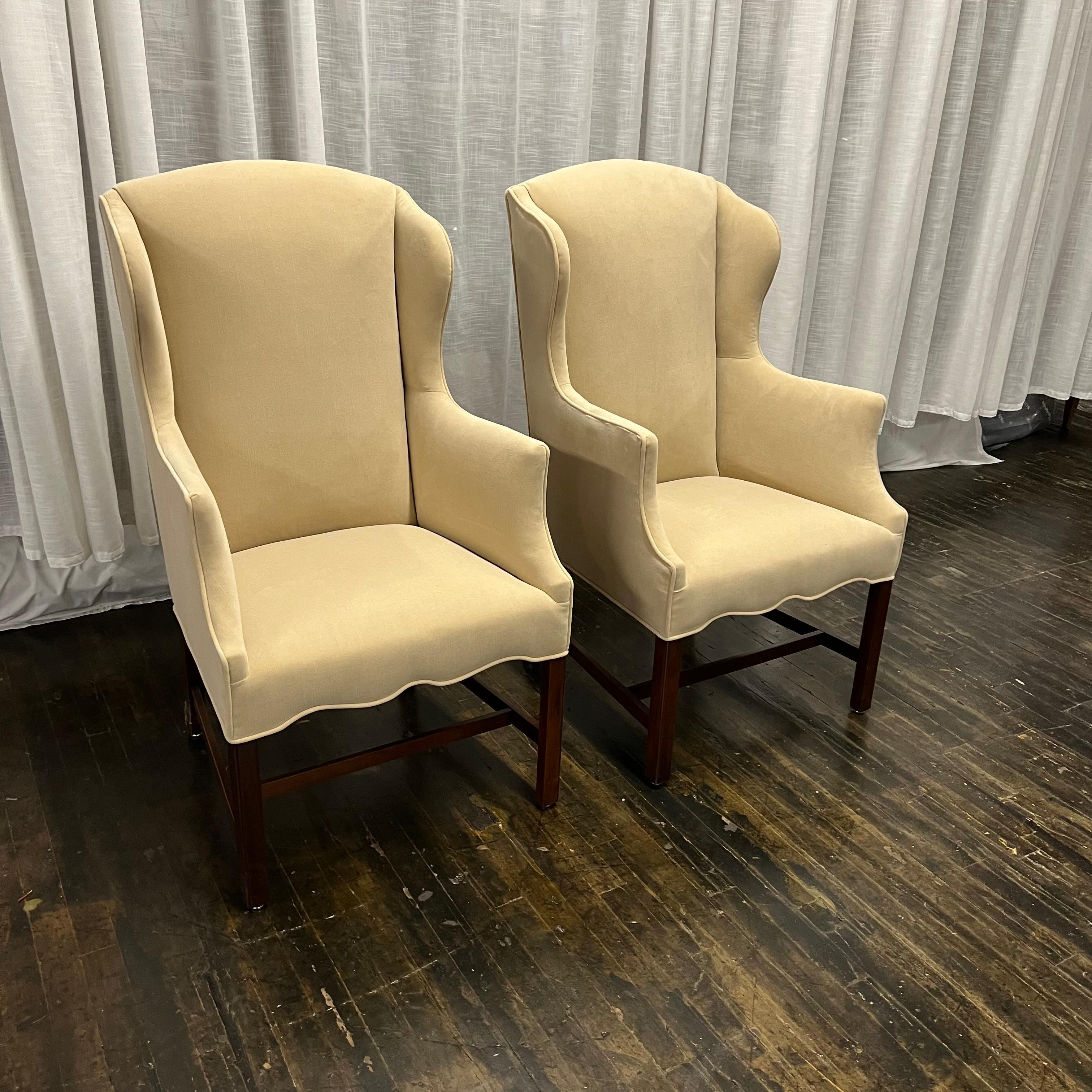 Recently reupholstered Chippendale style midcentury slim wing back chairs made by Hickory Chair. The original label was lost during reupholstery. They have a lovely scallop detail at the front and strong clean lines. They are a great size - not too