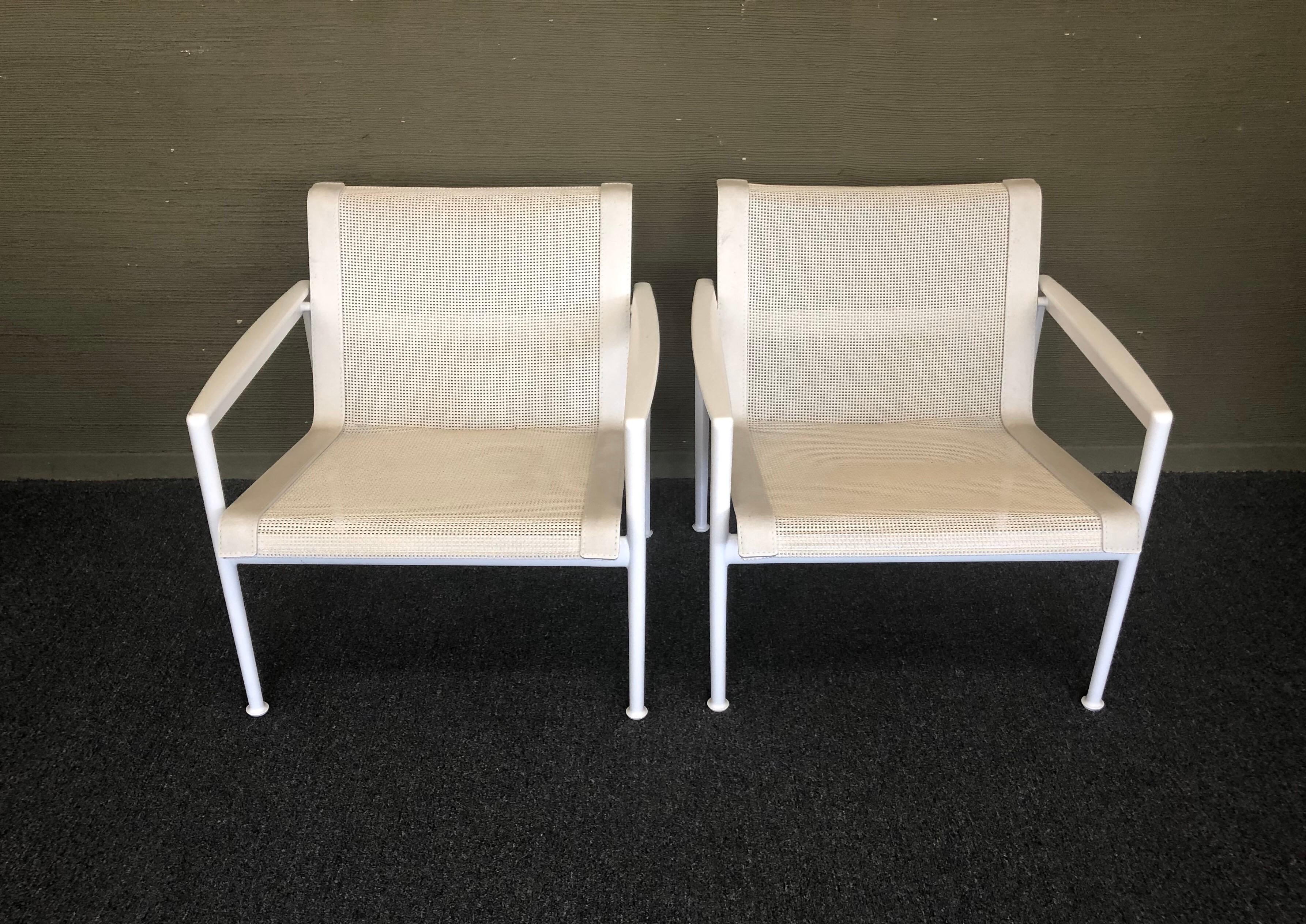 Handsome pair of sling lounge chairs with arms designed by Richard Schultz as part of his 1966 Collection for Knoll, circa 1990s. Craving furniture that could stand up to the salty environment of her seaside home in Florida, Florence Knoll called on