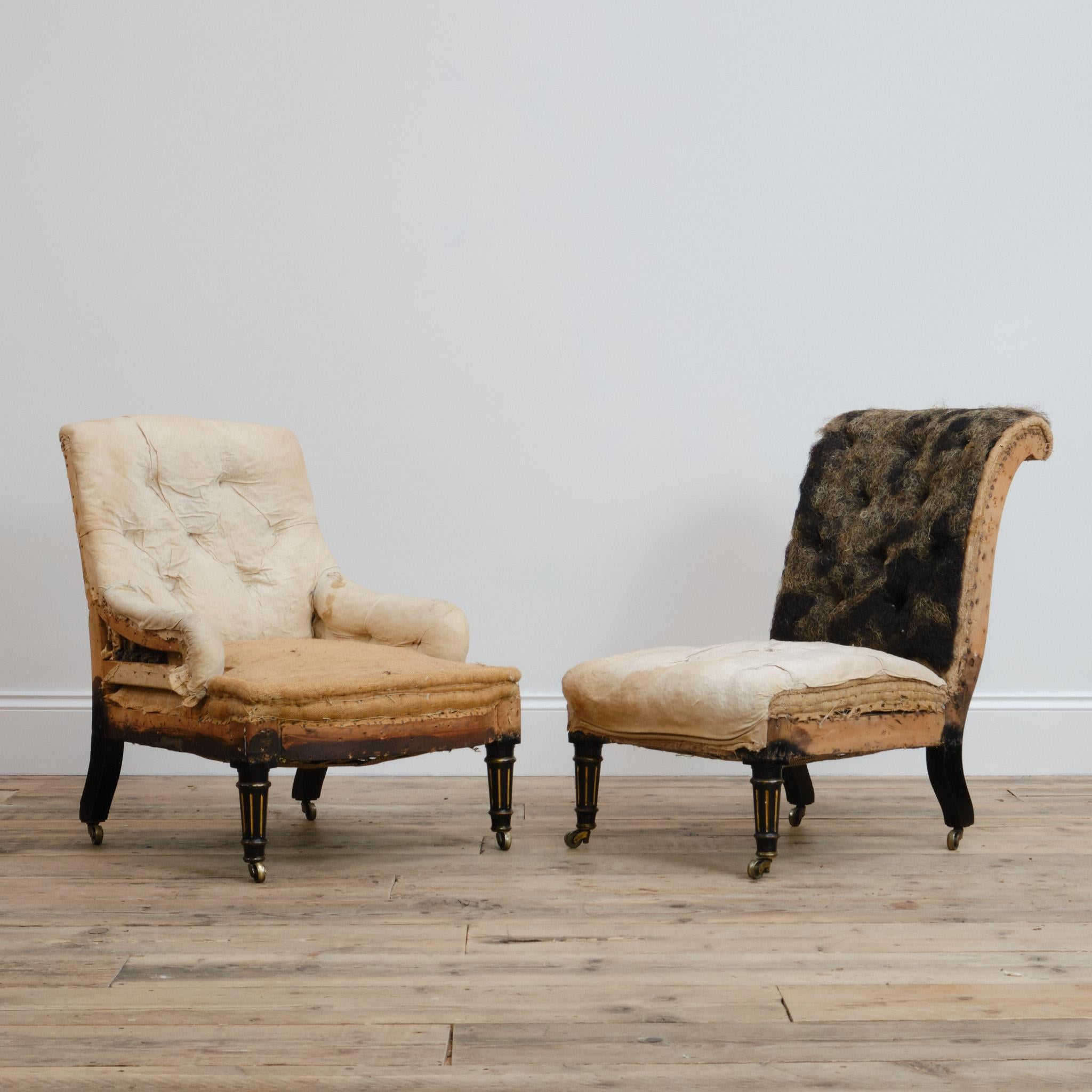 A pair 19th century bedroom chairs. Raised on ebonized and parcel gilt walnut legs with the original Cope & Collinson brass casters. Both chairs unstamped but almost certainly by Gillows of Lancaster. 

Retaining the original fillings that are in