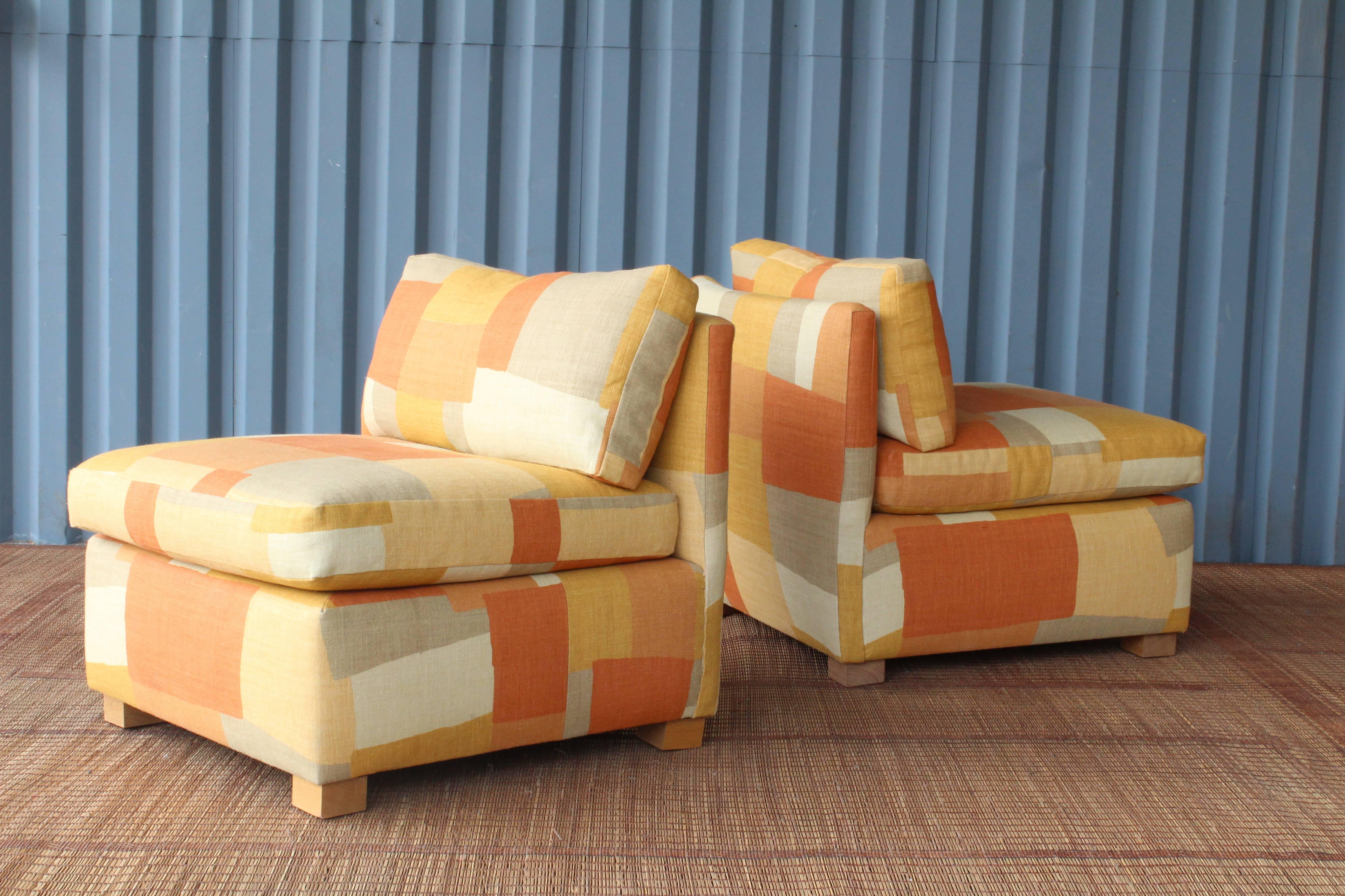 Pair of vintage slipper chairs designed by Milo Baughman for Thayer Coggin, 1970s. Oak feet. The pair have both been reupholstered in new 'Collage' fabric by Peter Dunham Textiles.