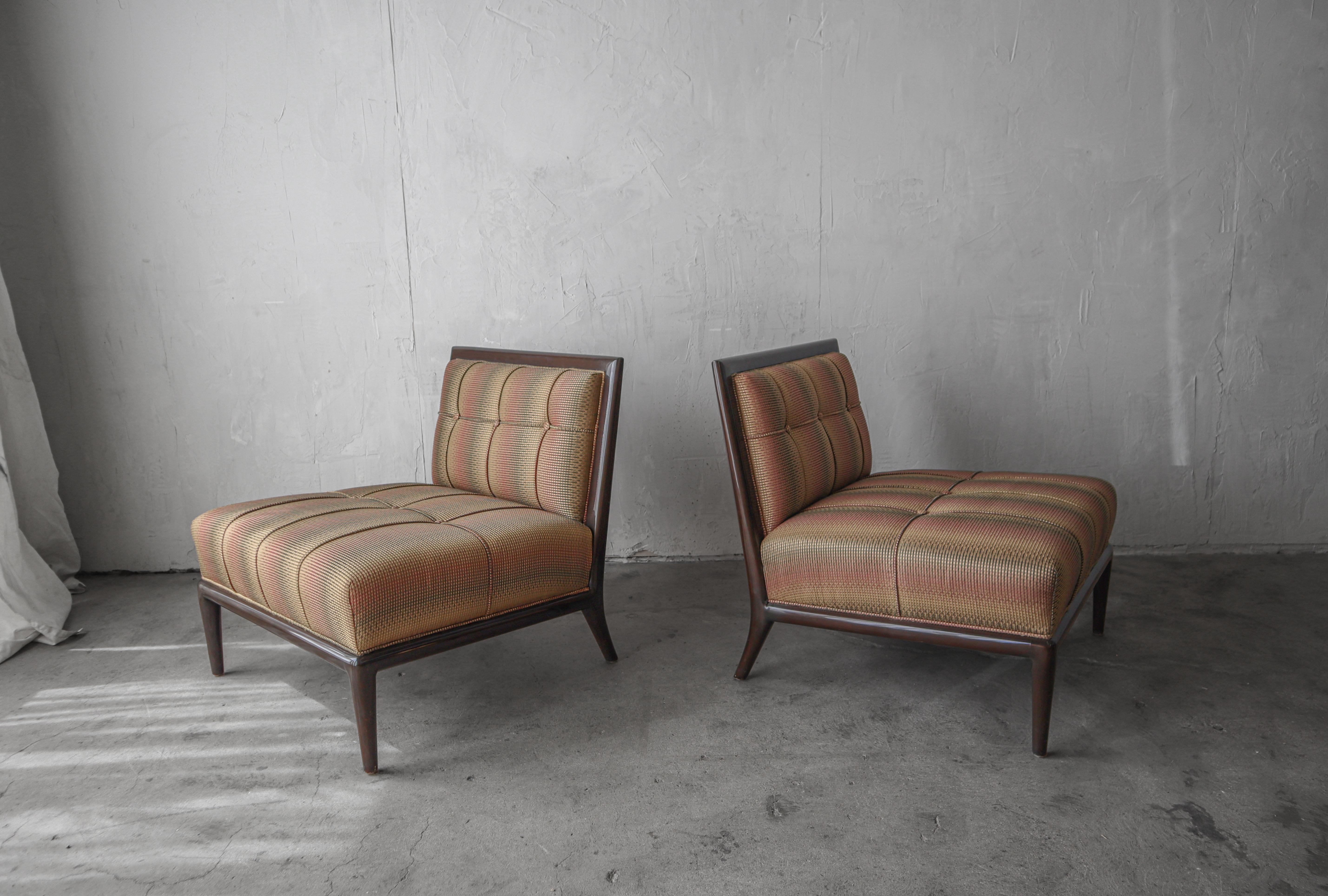 This pair of modern elegant slipper chairs by Nancy Corzine channel a classic mid century design from the 1950s by T.H. Robsjohn Gibbings and Manufactureed by Widdicomb.

They are left as found in excellent, all original condition.  The frames are