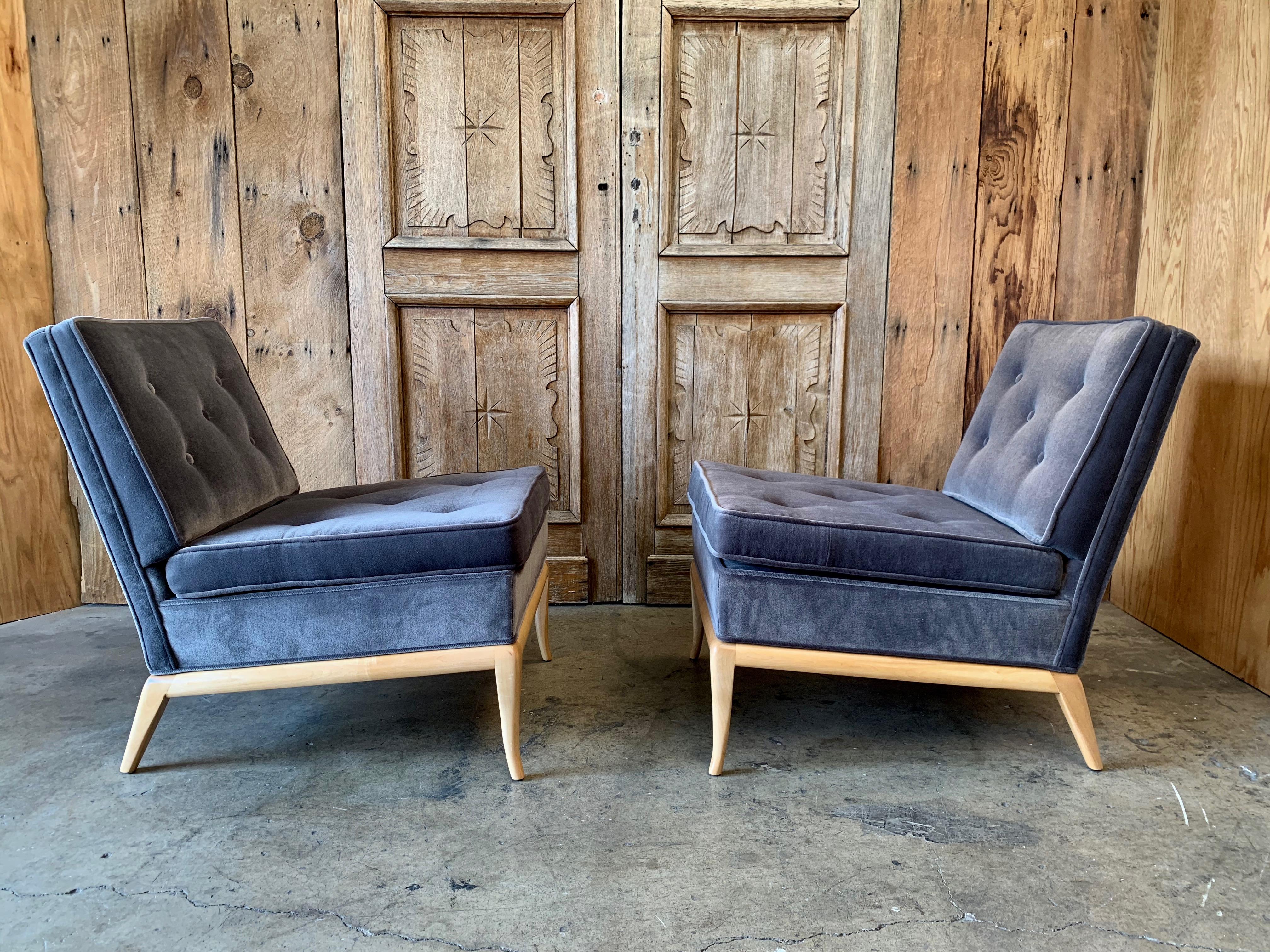 Pair of slipper lounge chairs by T.H. Robsjohn Gibbings. This pair has been upholstered in a blue gray velvet.